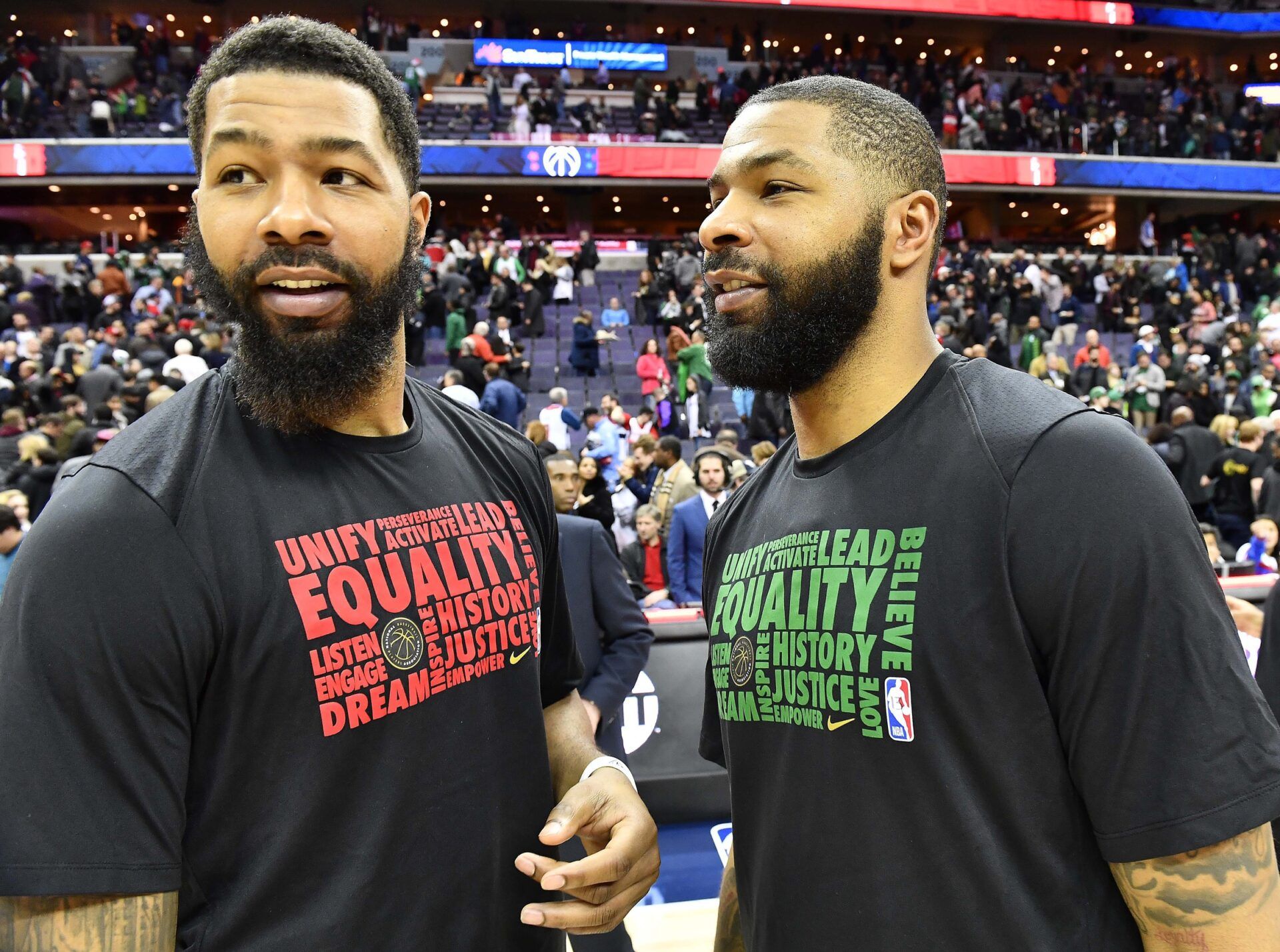 Washington Wizards forward Markieff Morris (left) talks with twin brother Boston Celtics forward Marcus Morris (right) after the game at Capital One Arena.