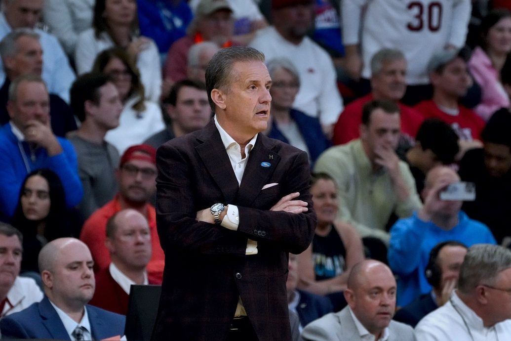 University of Arkansas coach John Calipari watches his razorbacks play against the Kansas Jayhawks in the first round of the NCAA tournament in Providence, RI.