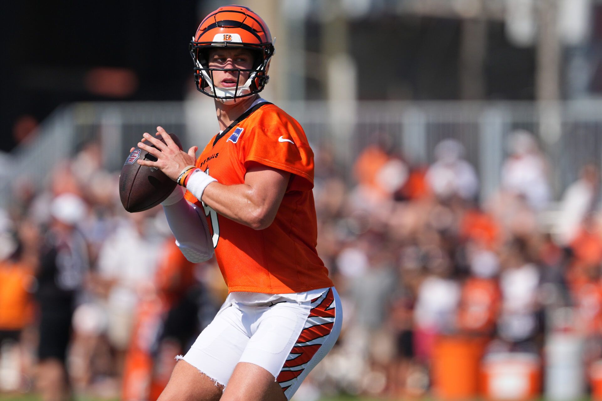 Cincinnati Bengals quarterback Joe Burrow (9) looks to throw during training camp practice.