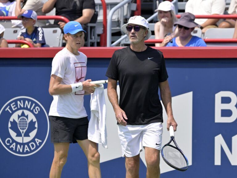 Jannik Sinner (ITA) (left) and coach Darren Cahill during practice at IGA Stadium.