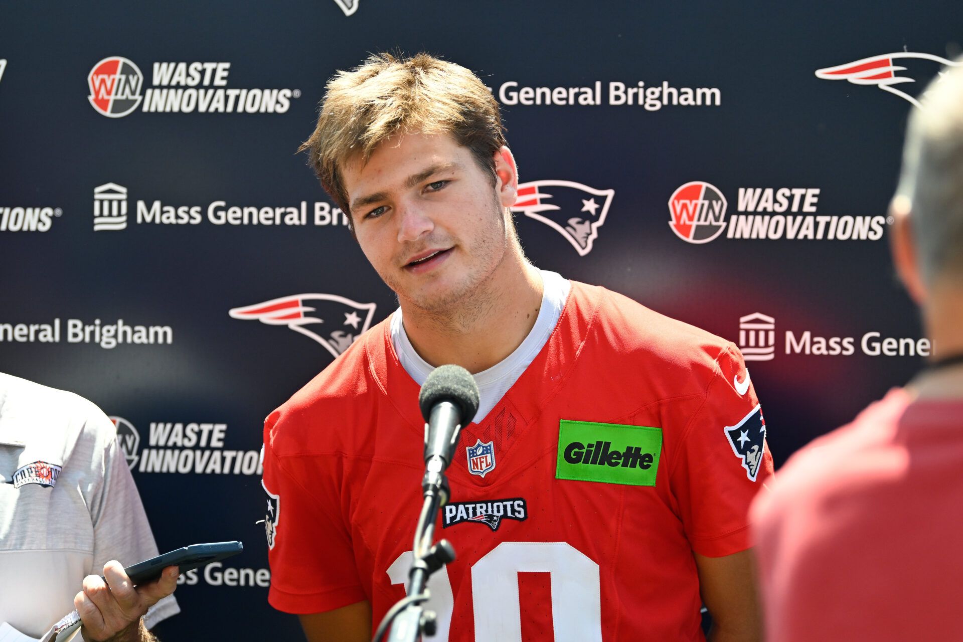 New England Patriots quarterback Drake Maye (10) addresses the media after practice during day one of training camp at Gillette Stadium.