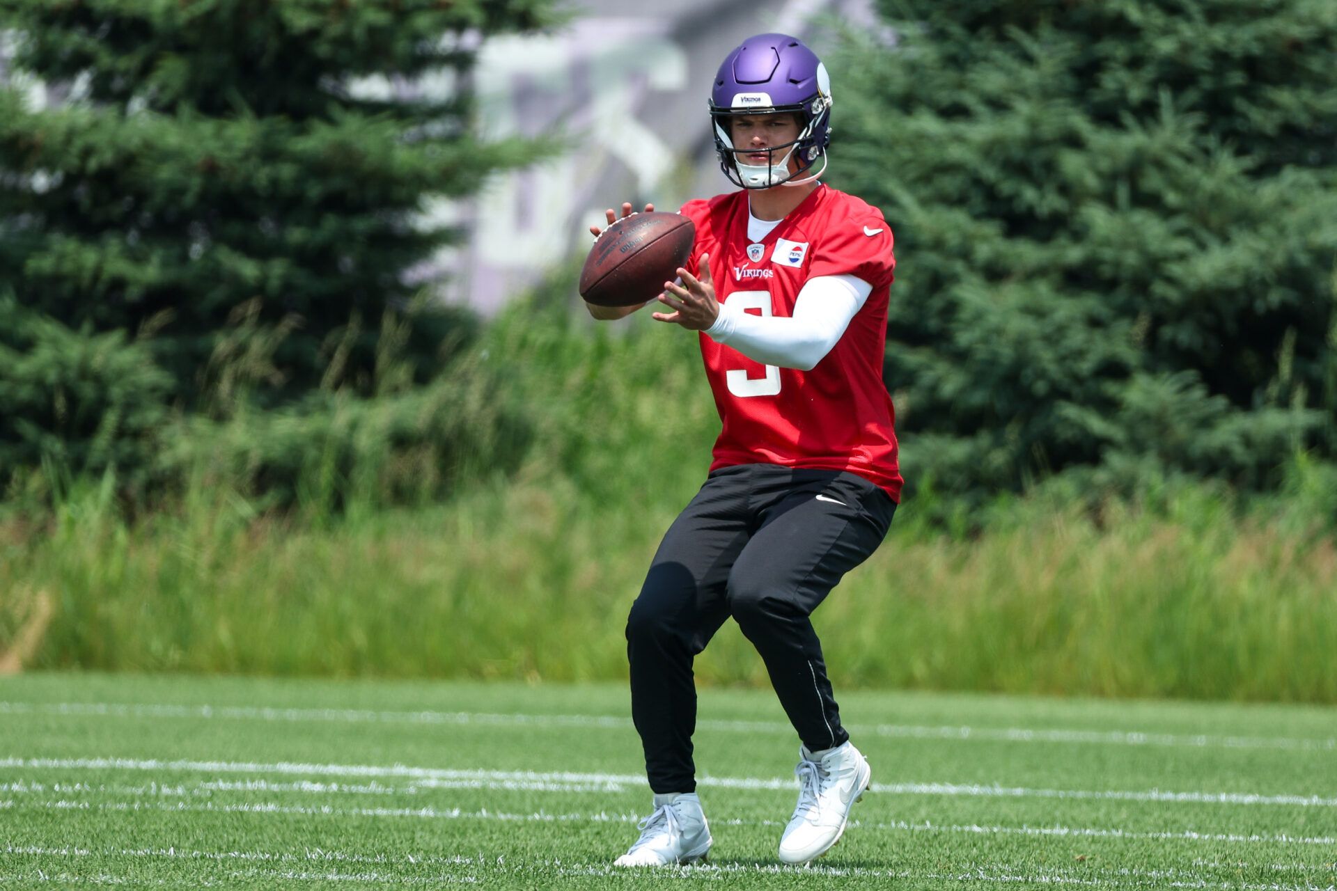 Minnesota Vikings quarterback J.J. McCarthy (9) practices during minicamp at the Minnesota Vikings Training Facility.