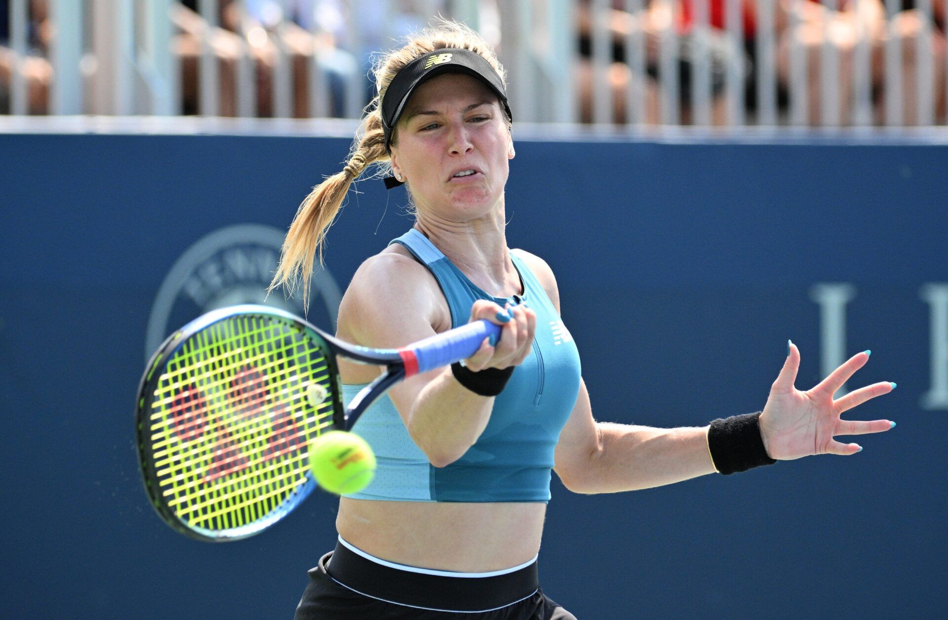 Eugenie Bouchard (CAN) plays a shot against Moyuka Uchijima (JPN) (not shown) during first round qualifying play at Sobeys Stadium.