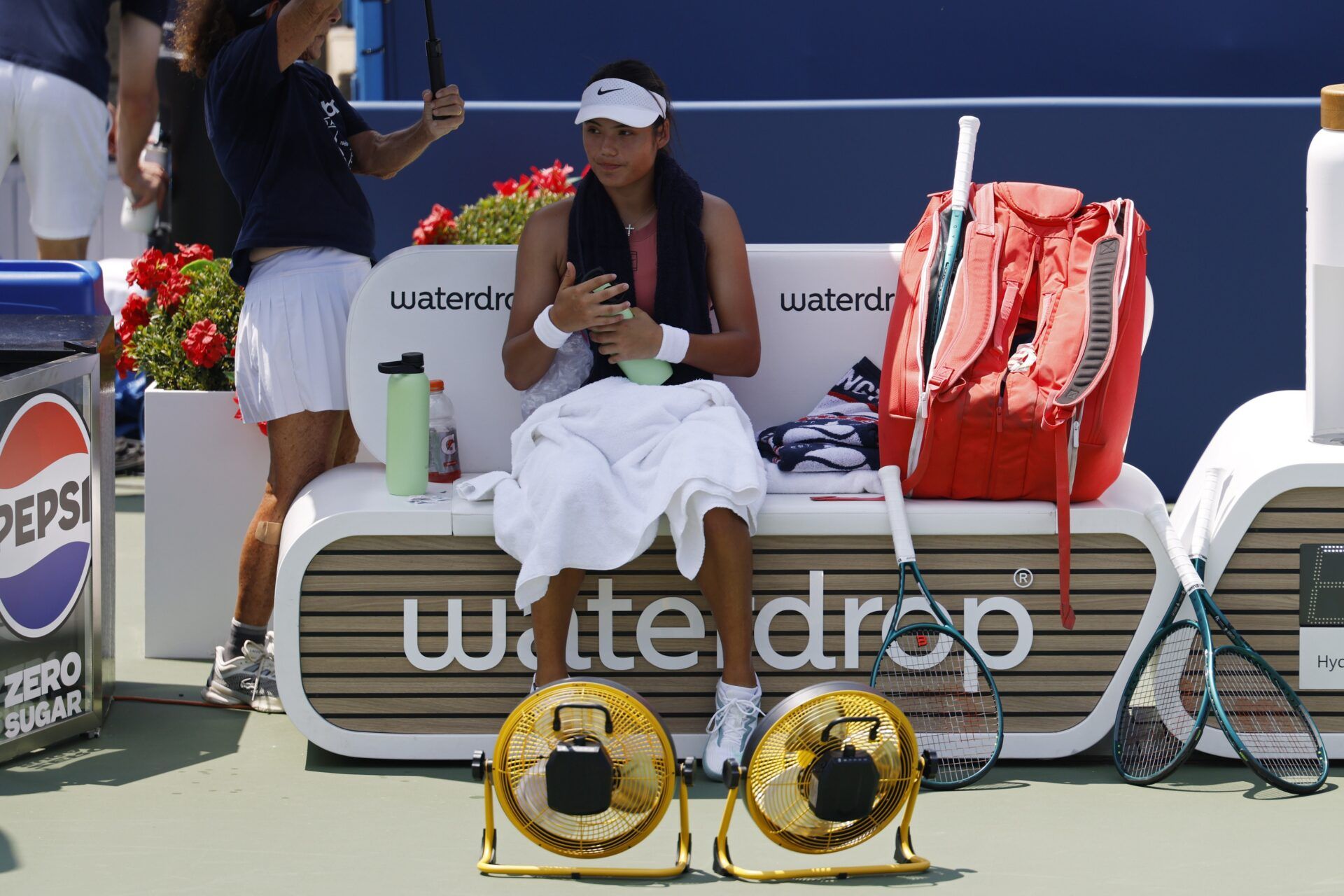 Emma Raducanu (GBR) sits in her player's chair during a changeover against Maria Sakkari (GRE)(not pictured) in a women's singles quarter-final of the Mubadala Citi DC Open at Rock Creek Park Tennis Center.