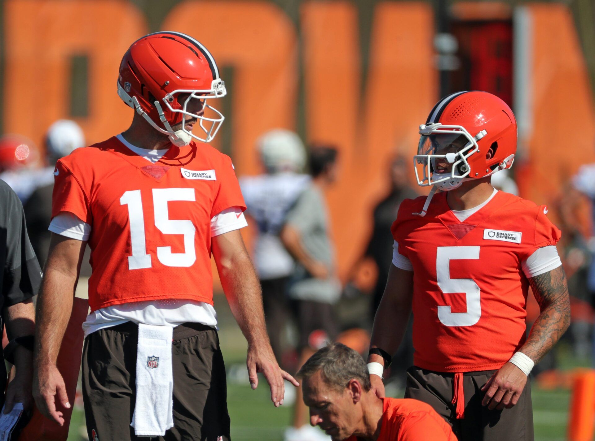 Cleveland Browns quarterback Joe Flacco (15) chats with quarterback Dillon Gabriel (5) during NFL training camp practice at the Cleveland Browns training facility, Wednesday, July 23, 2025, in Berea, Ohio.