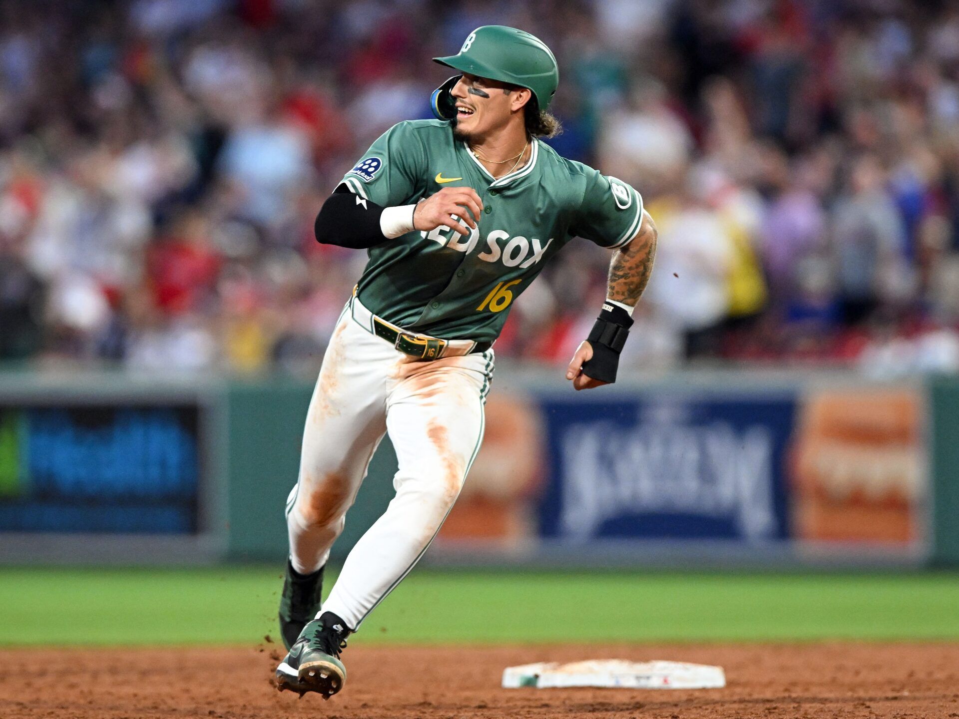 Boston Red Sox left fielder Jarren Duran (16) runs towards third base   during the third inning of a game against the Boston Red Sox at Fenway Park.