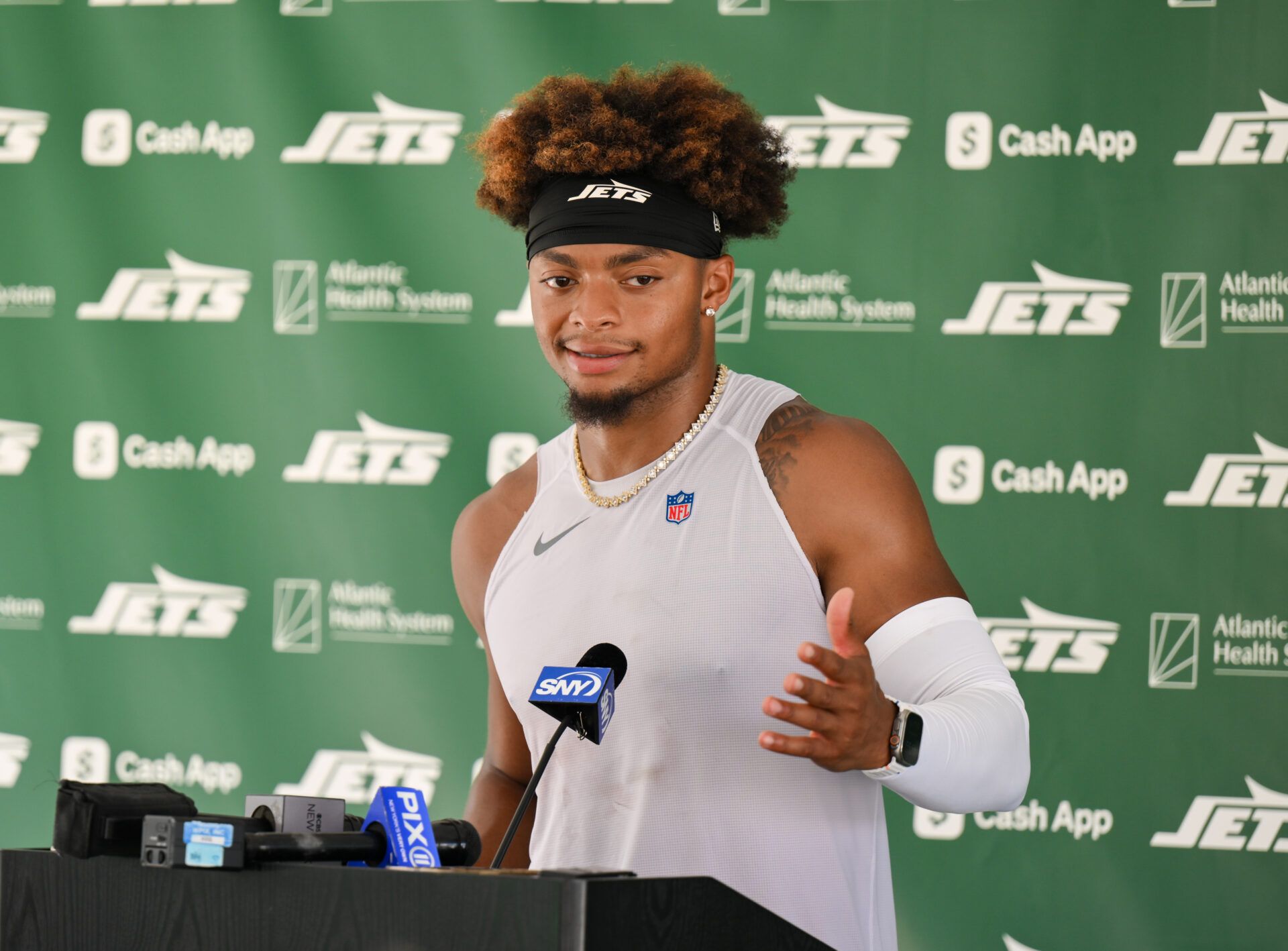 New York Jets quarterback Justin Fields (7) speaks at a press conference during training camp at Atlantic Health Jets Training Center.