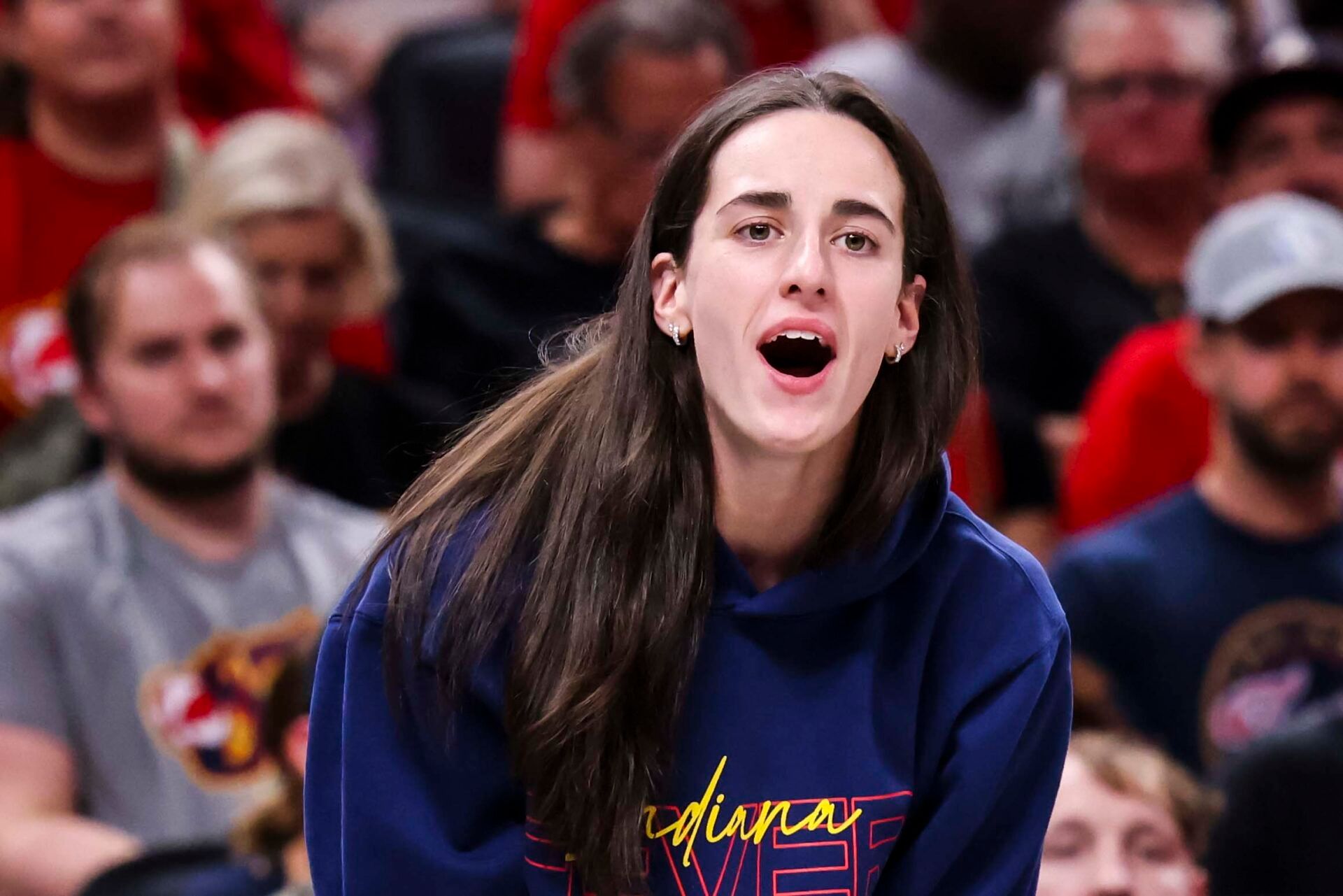Indiana Fever guard Caitlin Clark (22) reacts to the action against the Los Angeles Sparks during the first half at Gainbridge Fieldhouse.