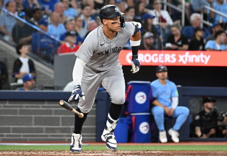 New York Yankees designated hitter Aaron Judge (99) hits a two run home run against the Toronto Blue Jays in the sixth inning at Rogers Centre.