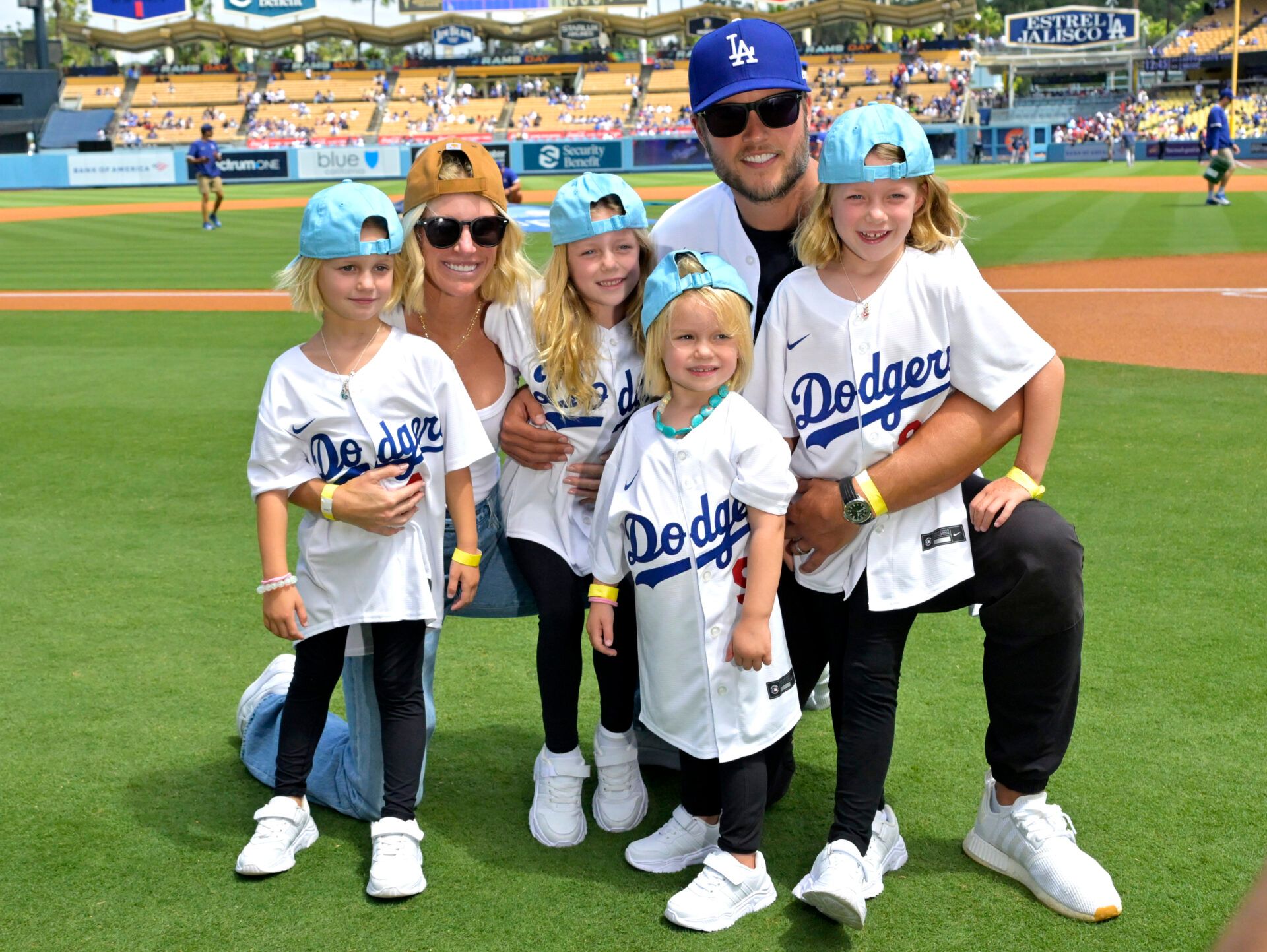 Los Angeles Rams quarterback Matthew Stafford (9) with his wife Kelly with their 4 daughters on the field prior to the game between the Los Angeles Dodgers and the Atlanta Braves at Dodger Stadium. Stafford was at the game on Rams day.