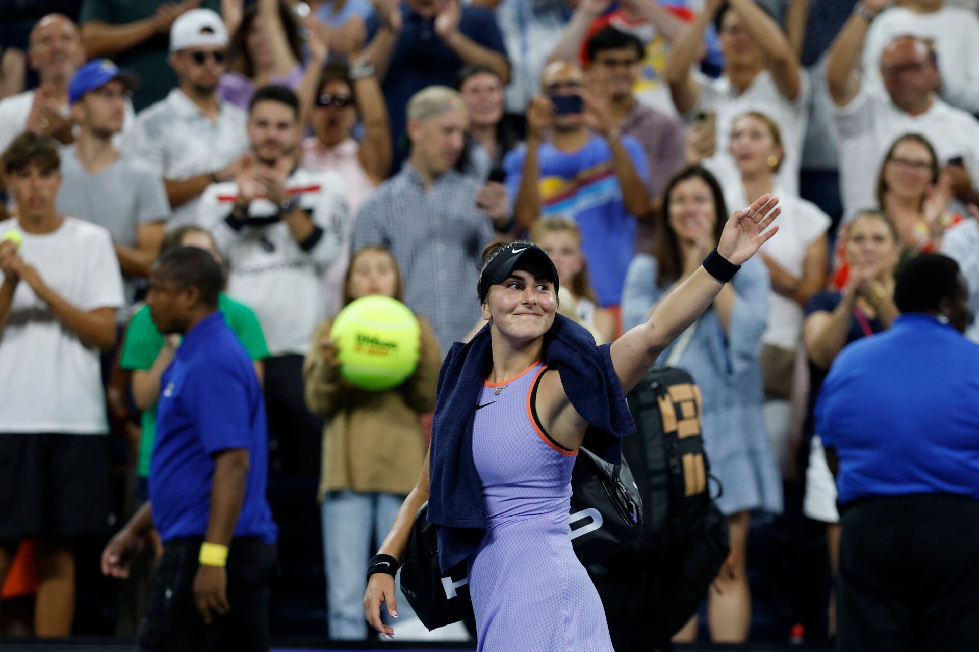 Bianca Andreescu (CAN) waves while leaving the court after her match against Jasmine Paolini (ITA) after their women's singles match on day two of the 2024 U.S. Open tennis tournament at USTA Billie Jean King National Tennis Center.