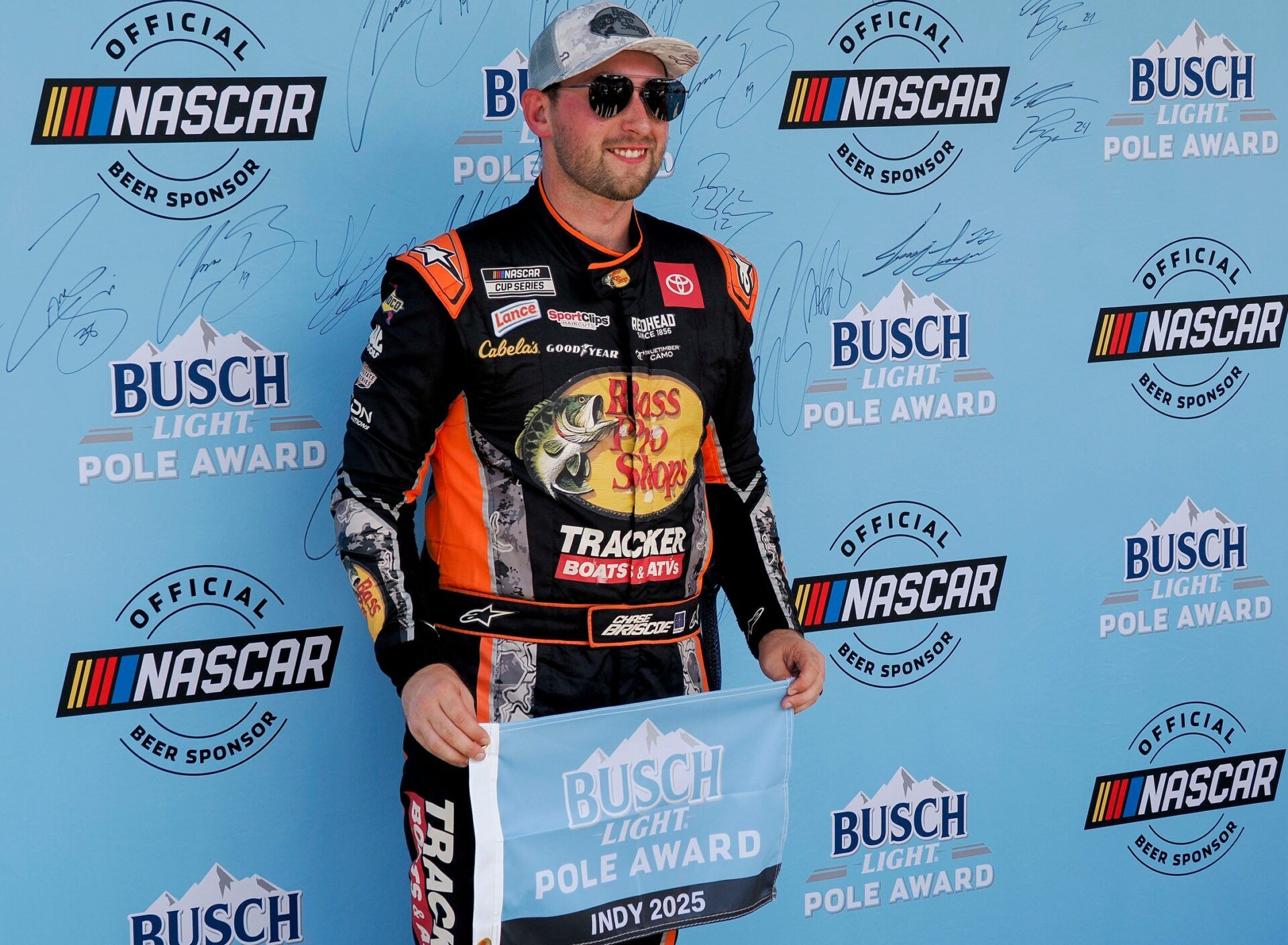 NASCAR Cup Series driver Chase Briscoe (19) poses for photos after winning the pole award Saturday, July 26, 2025, in qualifying for the Brickyard 400 at Indianapolis Motor Speedway.