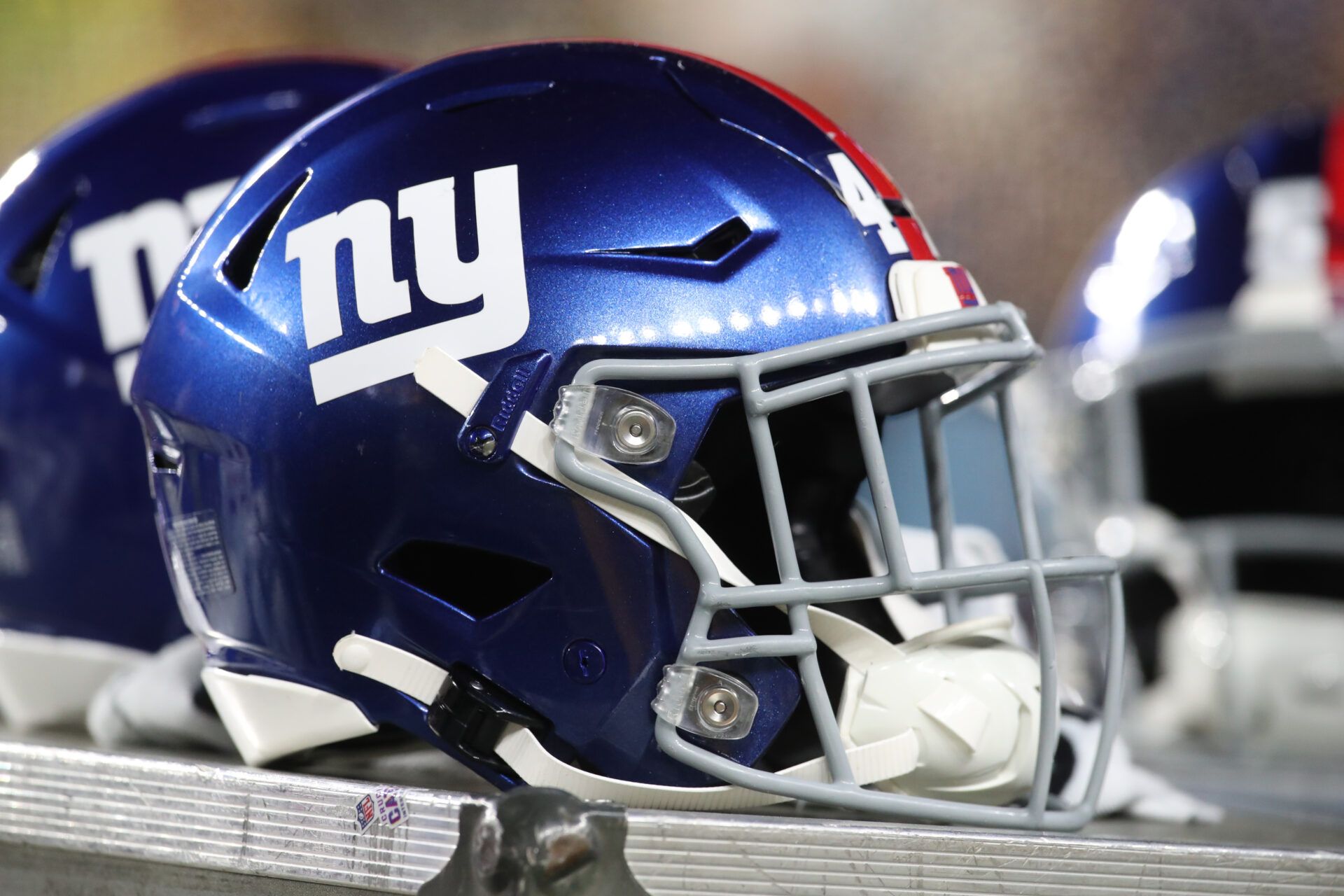 New York Giants helmets on the sidelines against the Pittsburgh Steelers during the third quarter at Acrisure Stadium.