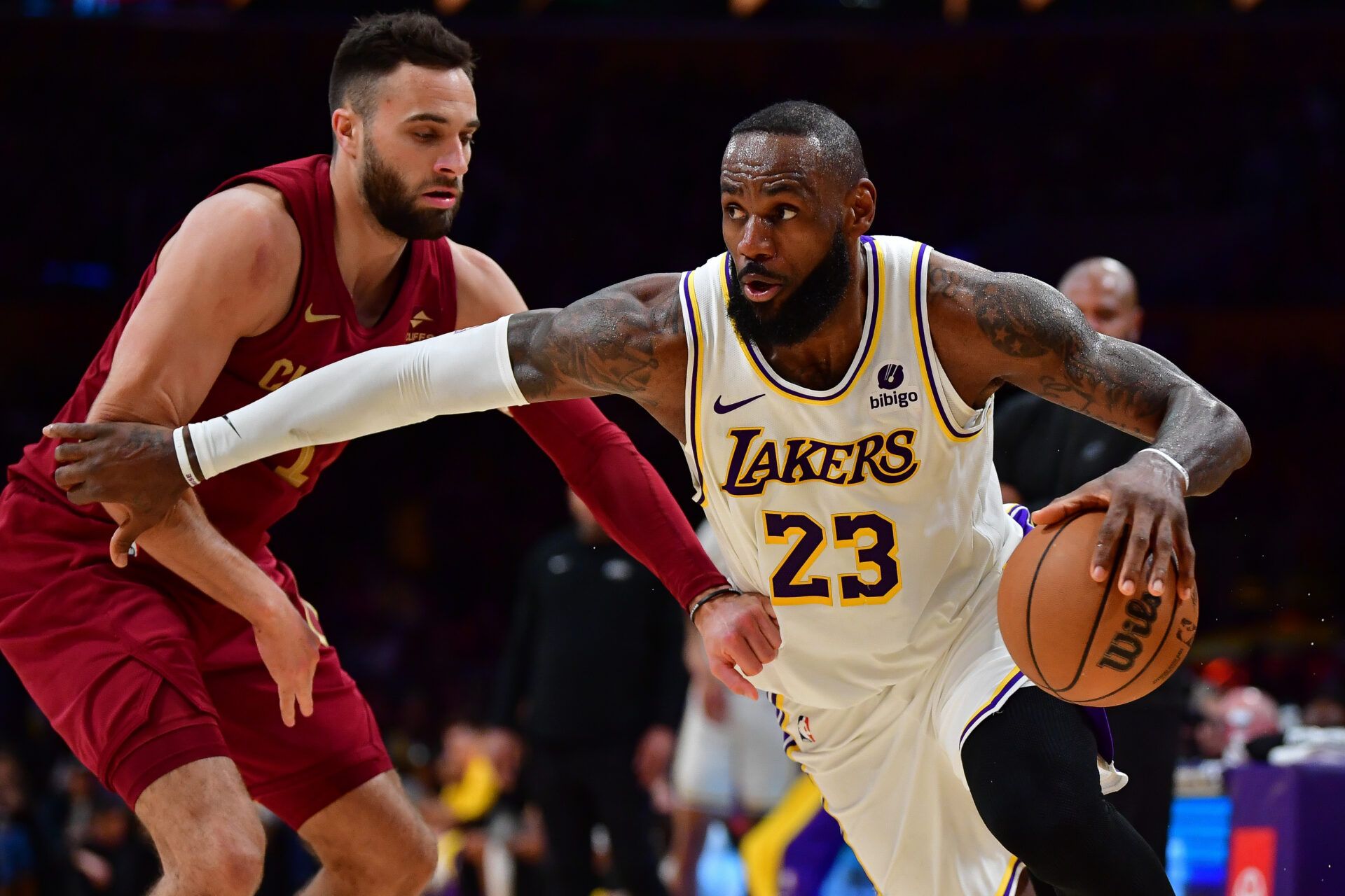 Los Angeles Lakers forward LeBron James (23) moves the ball against Cleveland Cavaliers guard Max Strus (1) during the second half at Crypto.com Arena.