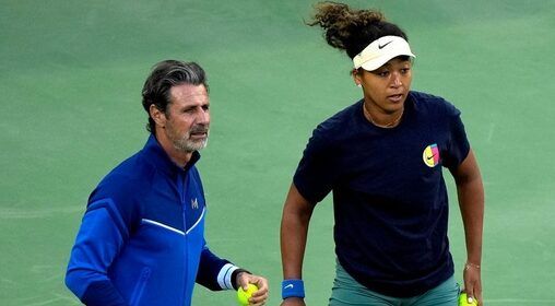 Tennis coach Patrick Mouratoglou, left, coaches Naomi Osaka during a practice session ahead of the main draw during the BNP Paribas Open at the Indian Wells Tennis Garden in Indian Wells, Calif., on Sunday, March 2, 2025.