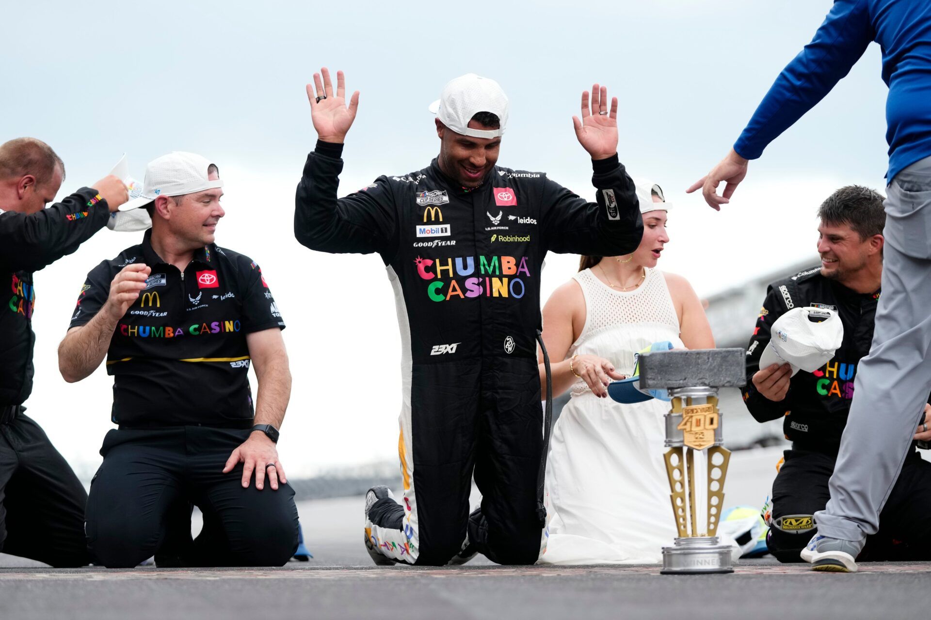 NASCAR Cup Series driver Bubba Wallace (23) celebrates on the yard of bricks Sunday, July 27, 2025, during the Brickyard 400 at Indianapolis Motor Speedway.