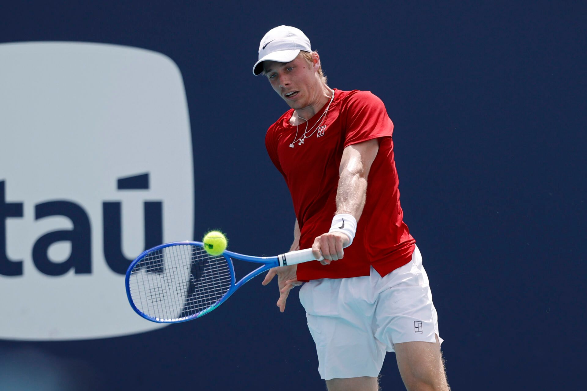 Denis Shapovalov (CAN) hits a backhand against Taylor Fritz (USA)(not pictured) on day seven of the Miami Open at Hard Rock Stadium.