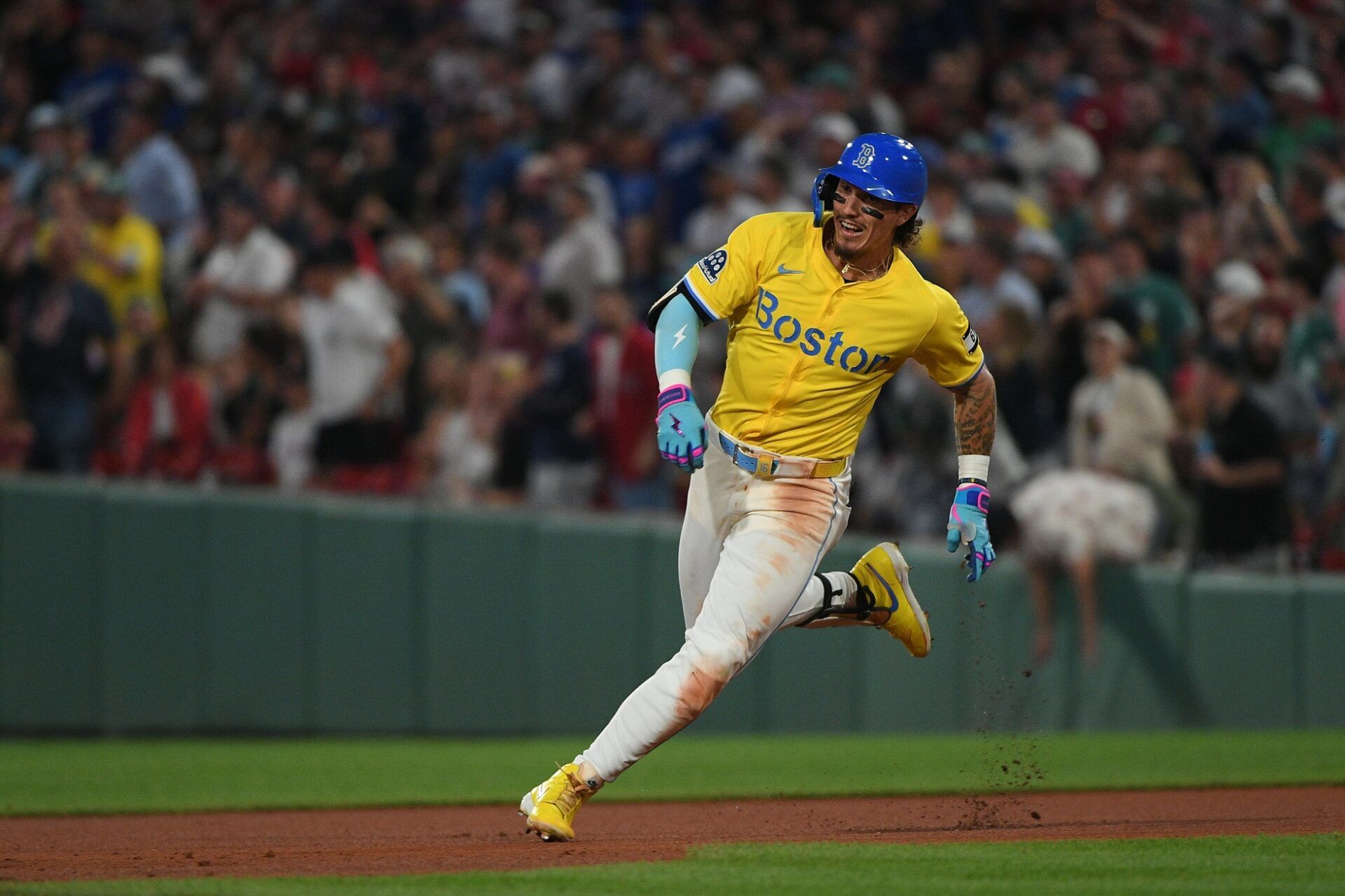 Boston Red Sox left fielder Jarren Duran (16) runs the bases en route to his second triple of the day during the sixth inning against the Los Angeles Dodgers at Fenway Park.