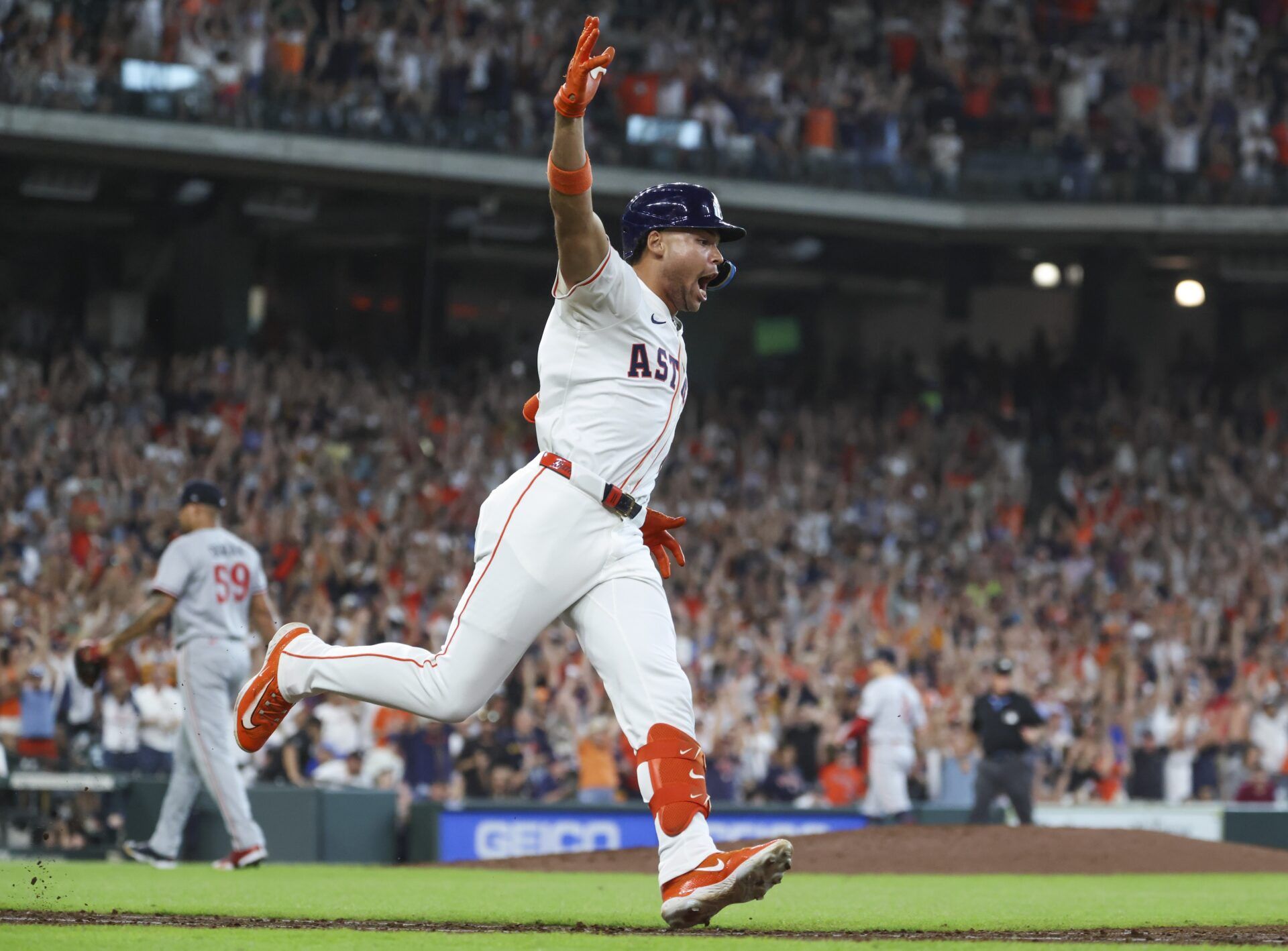Minnesota Twins relief pitcher Jhoan Duran (59) walks off the mound after Houston Astros right fielder Cam Smith (11) hits a walk-off RBI single during the ninth inning at Daikin Park.