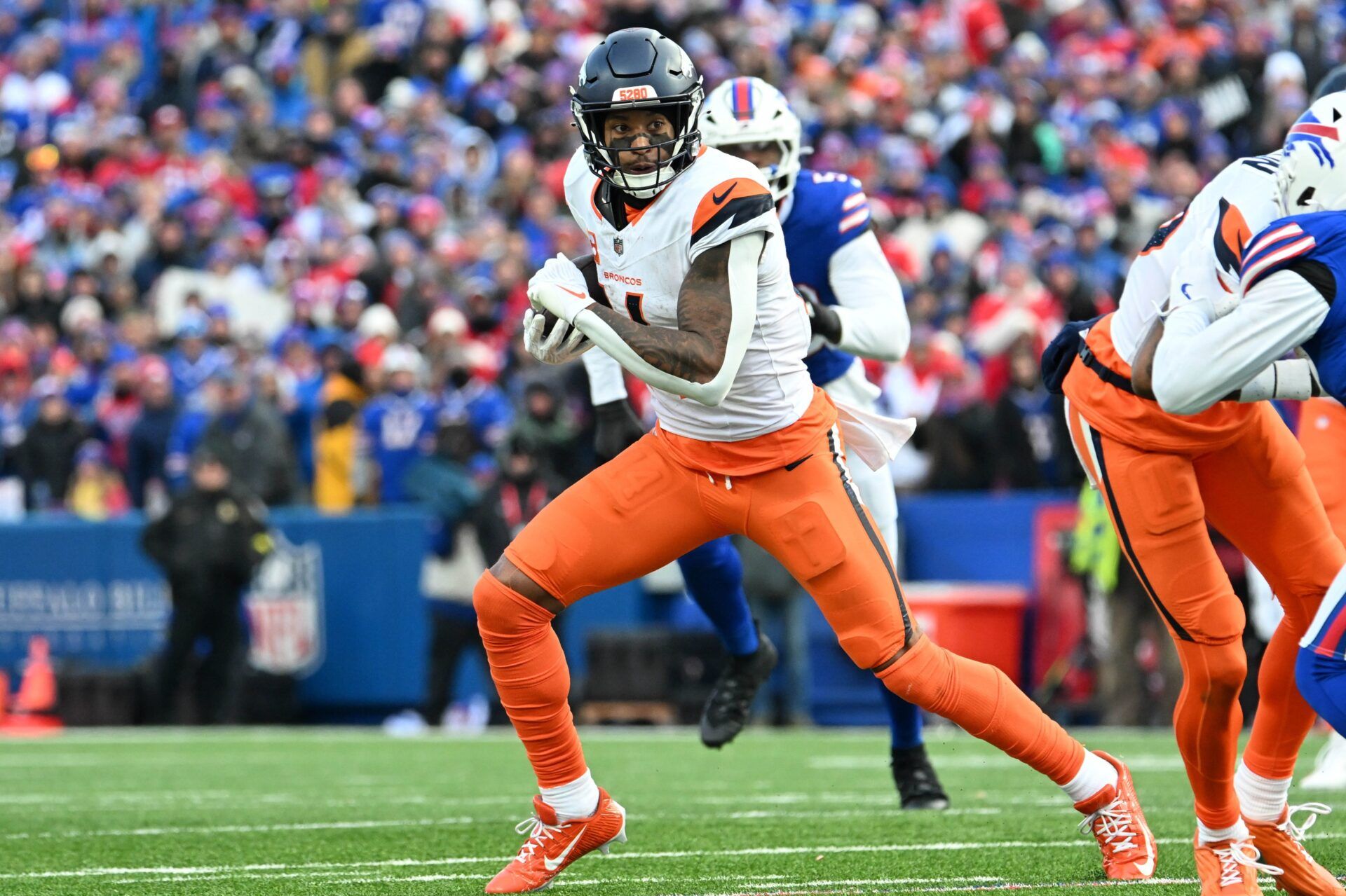Denver Broncos wide receiver Courtland Sutton (14) runs after making a catch in the fourth quarter of an AFC wild card game against the Buffalo Bills at Highmark Stadium.