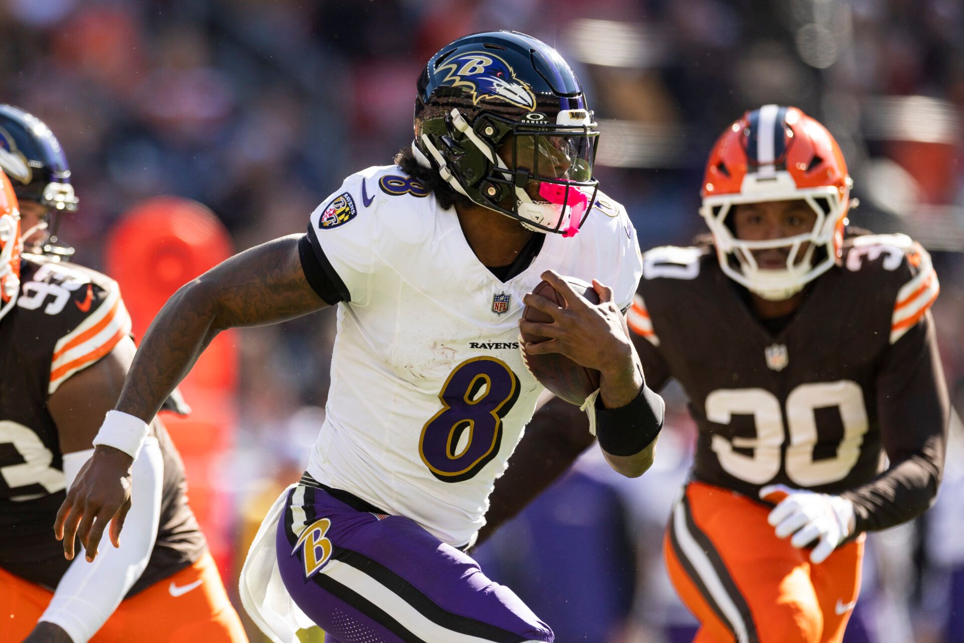 Baltimore Ravens quarterback Lamar Jackson (8) runs the ball against the Cleveland Brownsduring the second quarter at Huntington Bank Field.