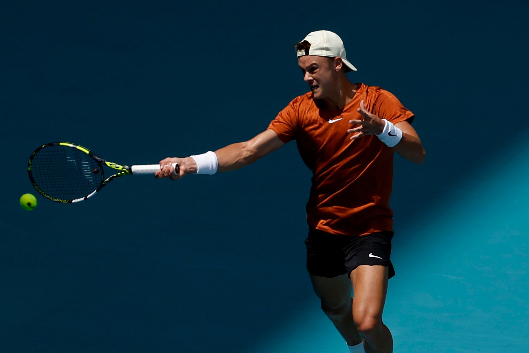 Holger Rune (DEN) hits a forehand against Taylor Fritz (USA) (not pictured) on day nine of the Miami Open at Hard Rock  Stadium.