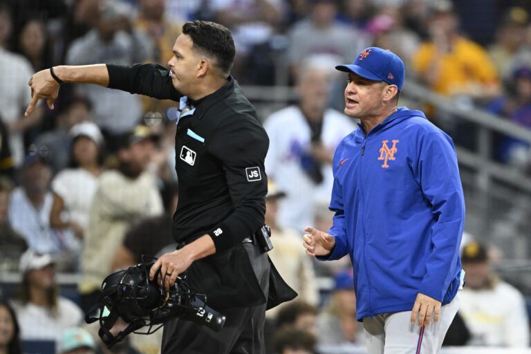 New York Mets manager Carlos Mendoza (64) is ejected by umpire Emil Jimenez (82) after a called strike out during the third inning against the San Diego Padres at Petco Park.