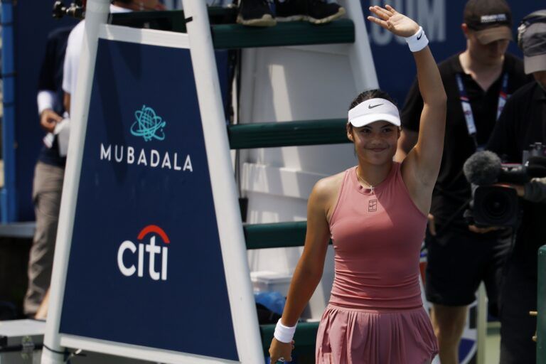 Emma Raducanu (GBR) waves to the crowd after her match against Maria Sakkari (GRE)(not pictured) in a women's singles quarter-final of the Mubadala Citi DC Open at Rock Creek Park Tennis Center.