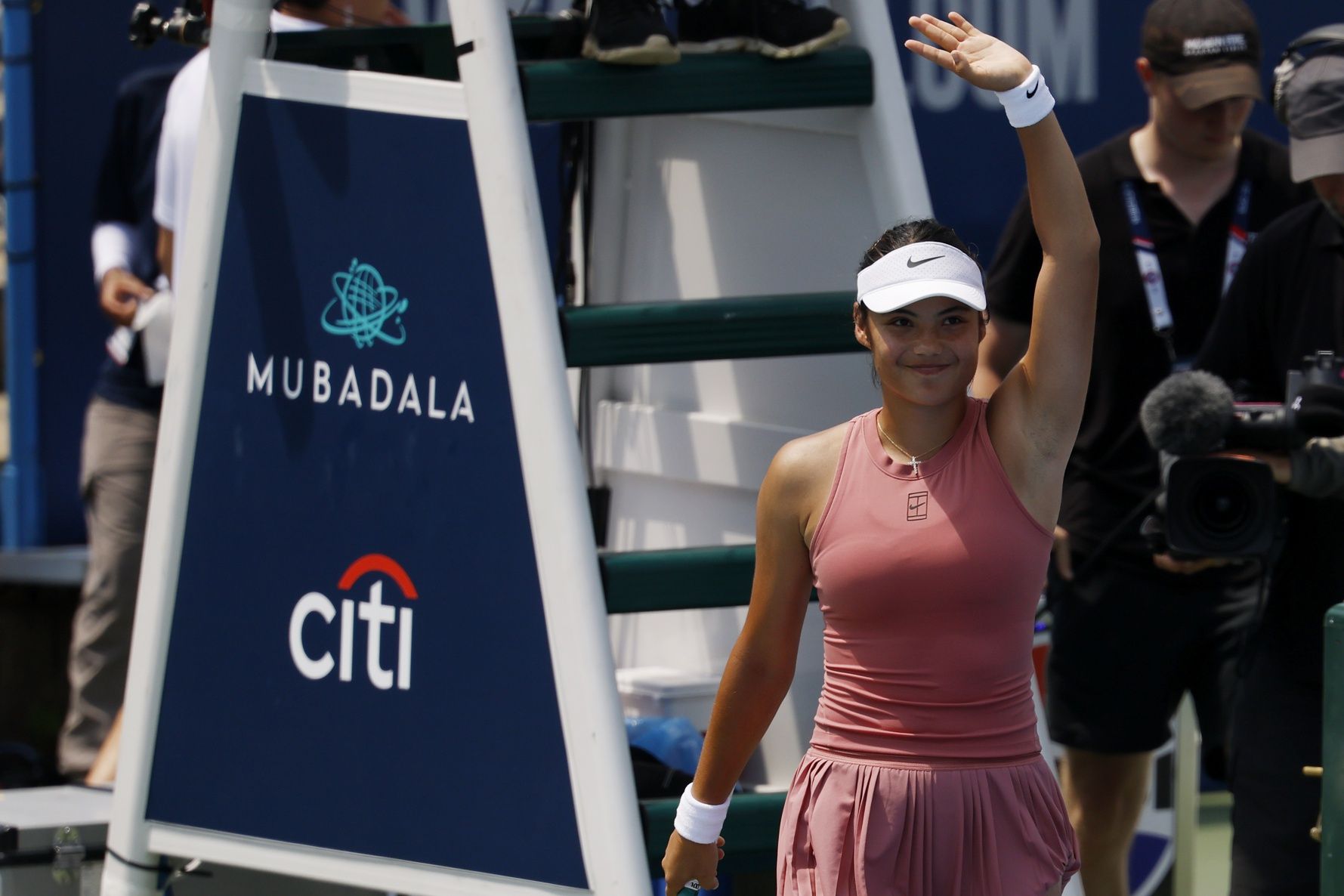 Emma Raducanu (GBR) waves to the crowd after her match against Maria Sakkari (GRE)(not pictured) in a women's singles quarter-final of the Mubadala Citi DC Open at Rock Creek Park Tennis Center.