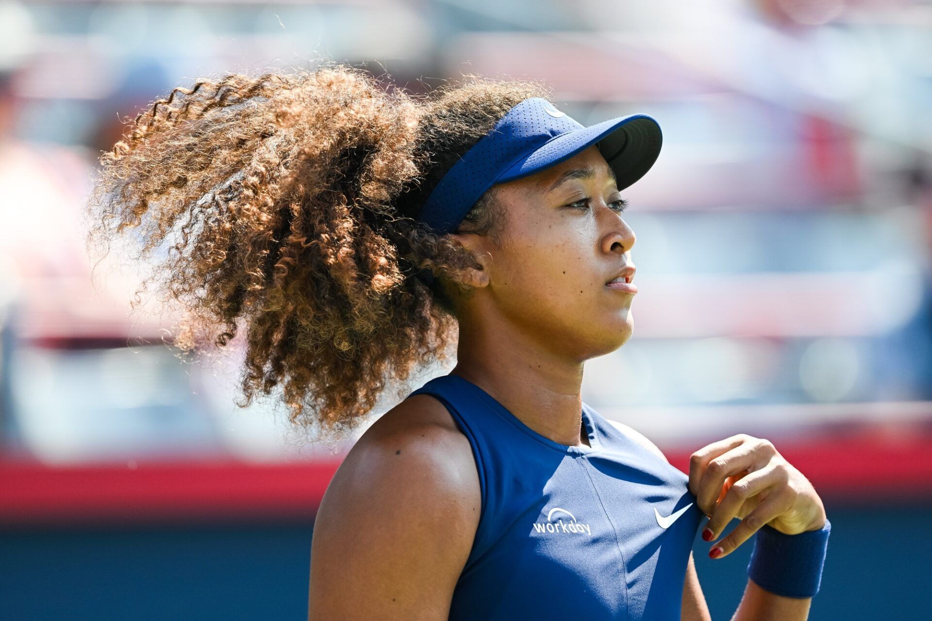 Naomi Osaka (JPN) looks on against Ariana Arseneault (CAN) in first round play at IGA Stadium.