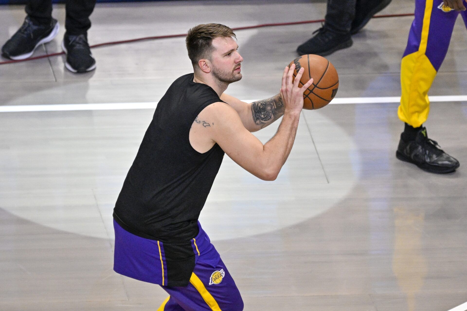 Los Angeles Lakers guard Luka Doncic (77) warms up before the game between the Dallas Mavericks and the Los Angeles Lakers at American Airlines Center.