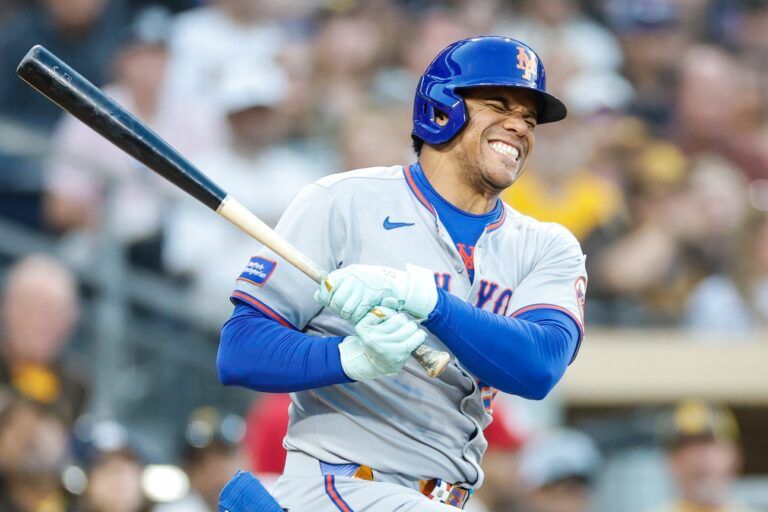 New York Mets right fielder Juan Soto (22) reacts after fouling off a ball off his lower extremity during the fourth inning against the San Diego Padres at Petco Park.
