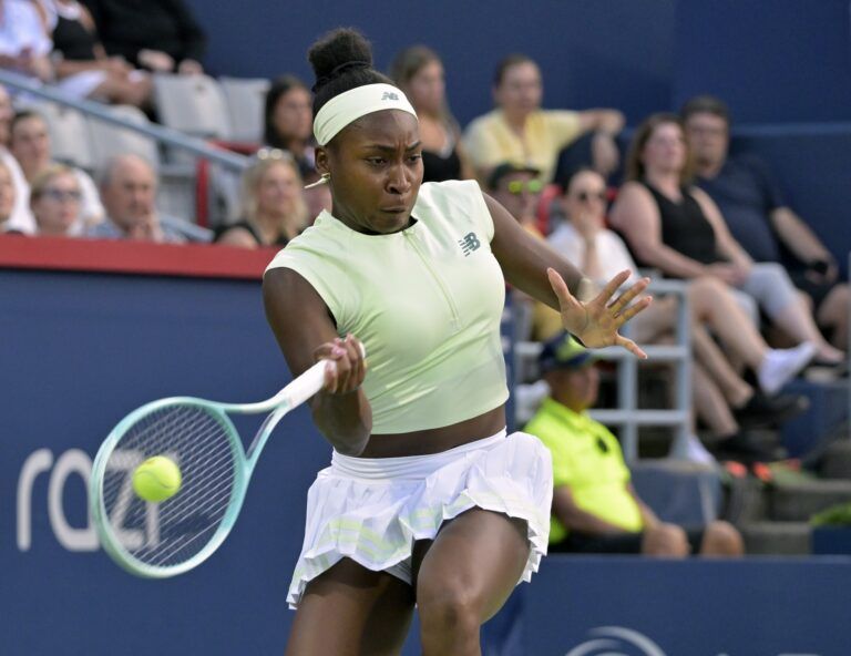Coco Gauff (USA) returns the ball against Danielle Collins (USA) in second round play at IGA Stadium.