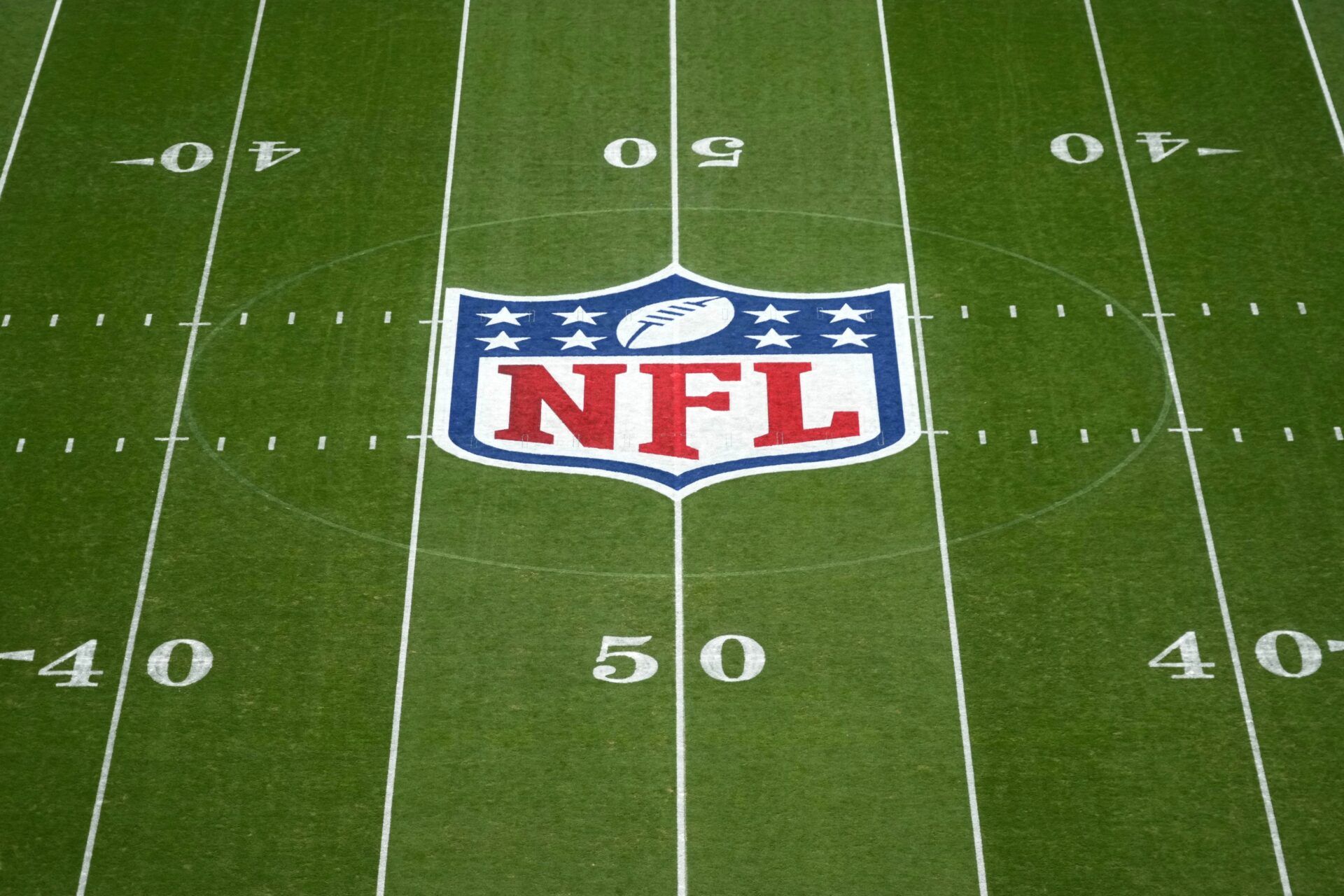 The NFL shield logo at midfield during the 2024 NFL Munich Game at Allianz Arena.
