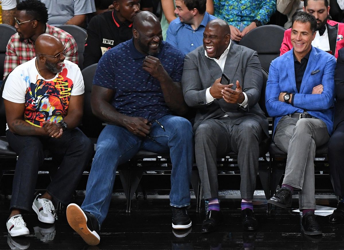 NBA Hall of Famers Shaquille O'Neal and Magic Johnson share a laugh during the second half between the Los Angeles Lakers and the Golden State Warriors at T-Mobile Arena.