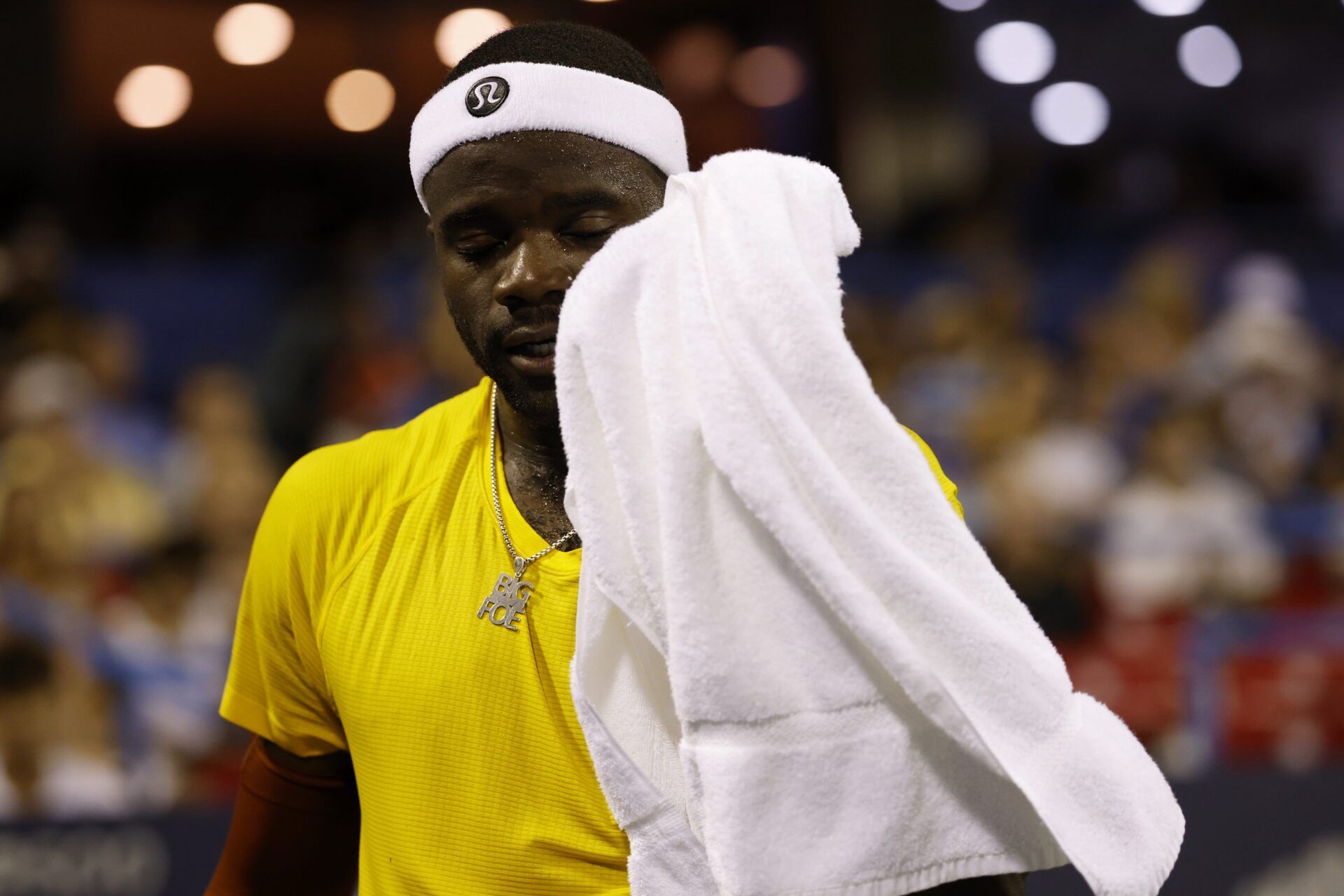 Frances Tiafoe (USA) wipes his face between points against Ben Shelton (USA)(not pictured) in a men's singles quarter-final of the Mubadala Citi DC Open at Rock Creek Park Tennis Center.