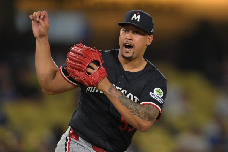 Minnesota Twins relief pitcher Jhoan Duran (59) reacts after the final out of the ninth inning against the Los Angeles Dodgers at Dodger Stadium.