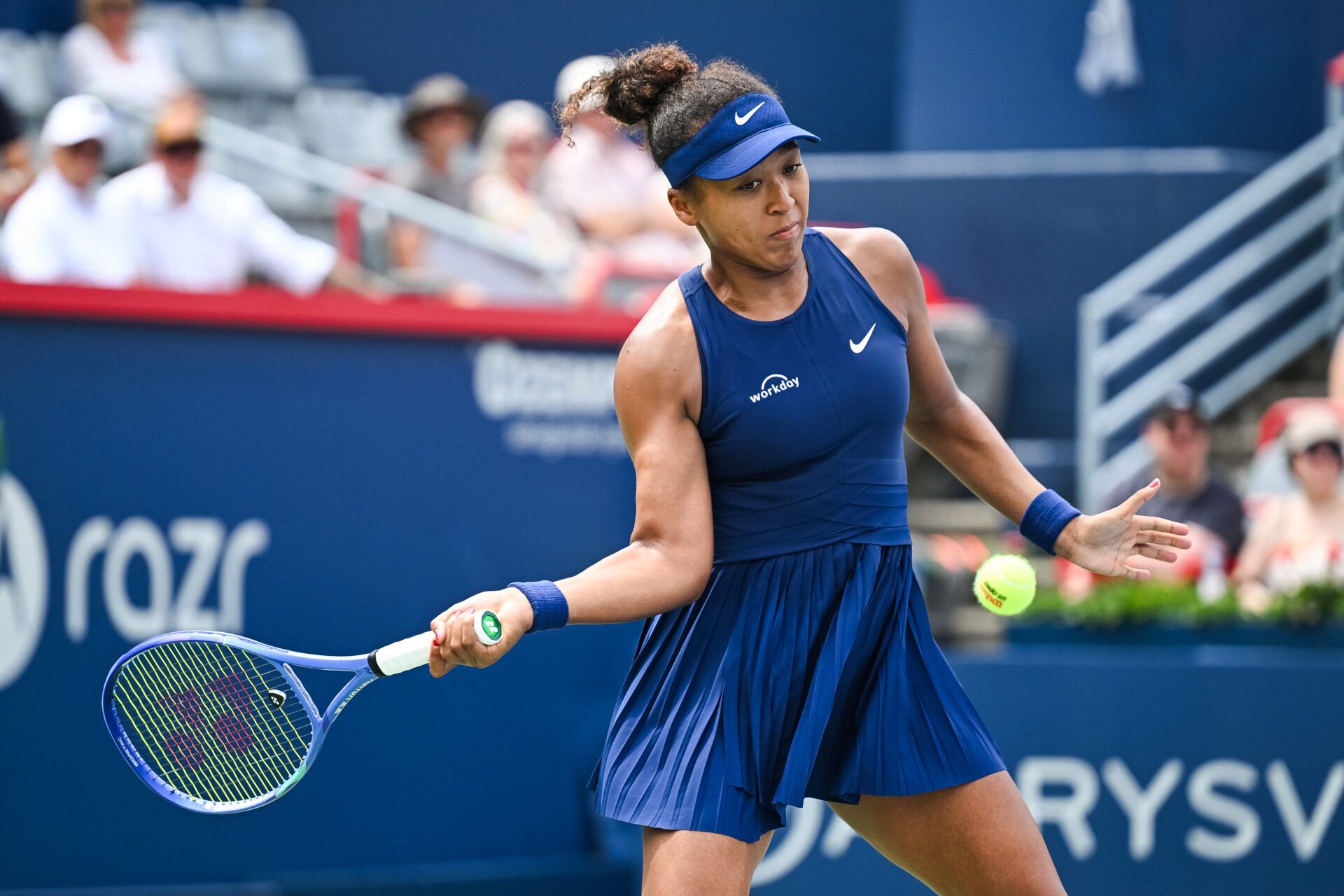 Naomi Osaka (JPN) returns the ball to Liudmila Samsonova in second round play at IGA Stadium.