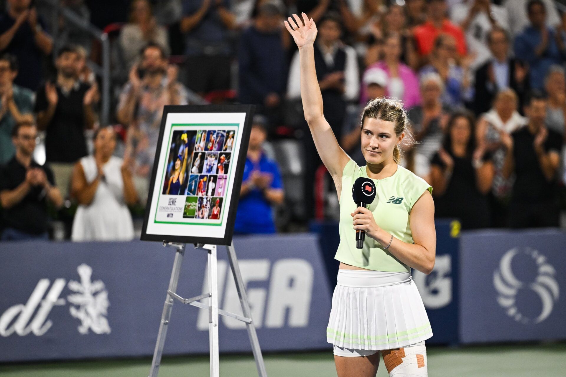 Eugenie Bouchard (CAN) salutes the crowd during her retirement ceremony at IGA Stadium.