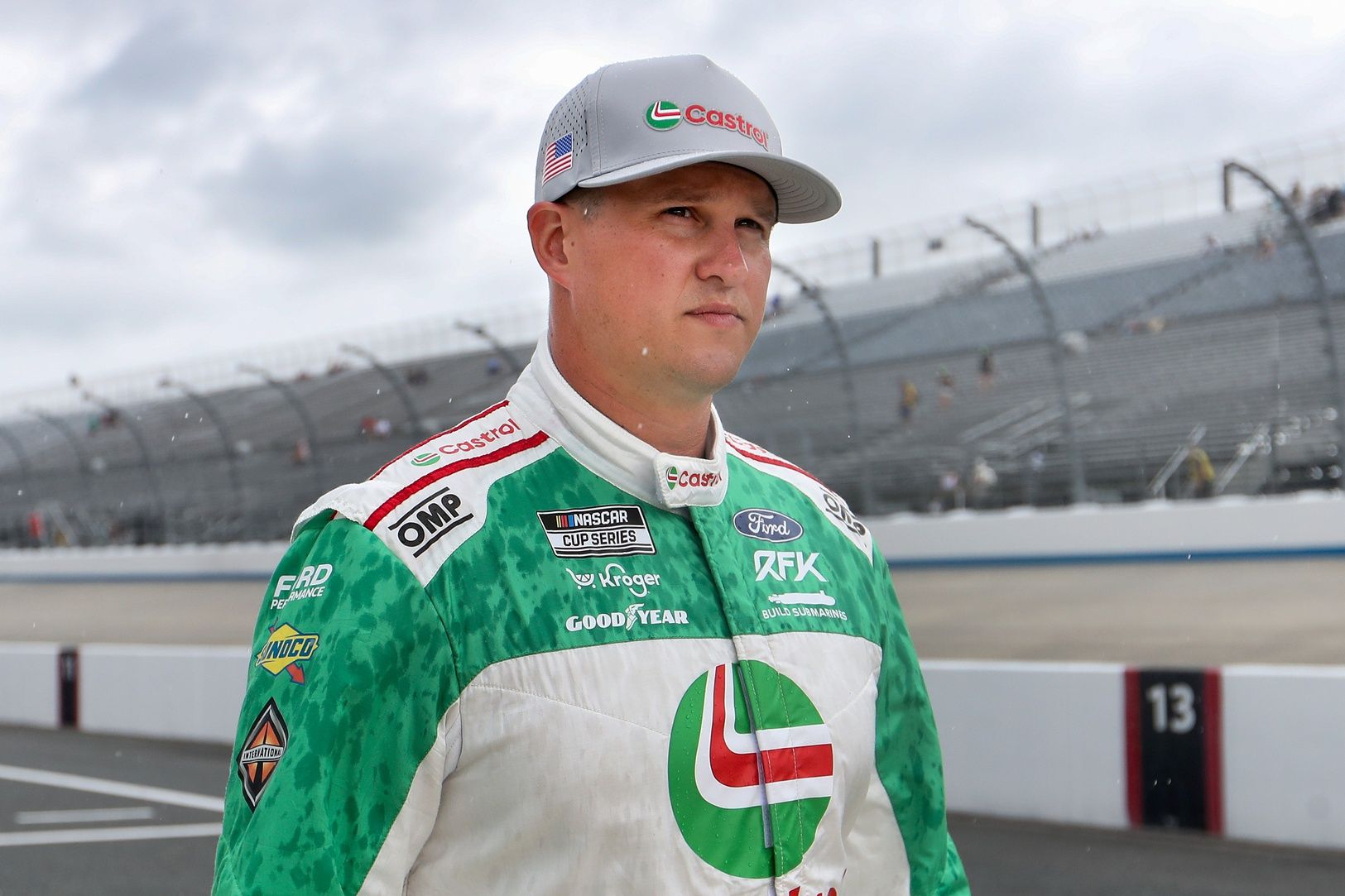 NASCAR Cup Series driver Ryan Preece walks on pit road as rain falls delaying the start of practice and qualifying for the Autotrader EchoPark Automotive 400 at Dover Motor Speedway.
