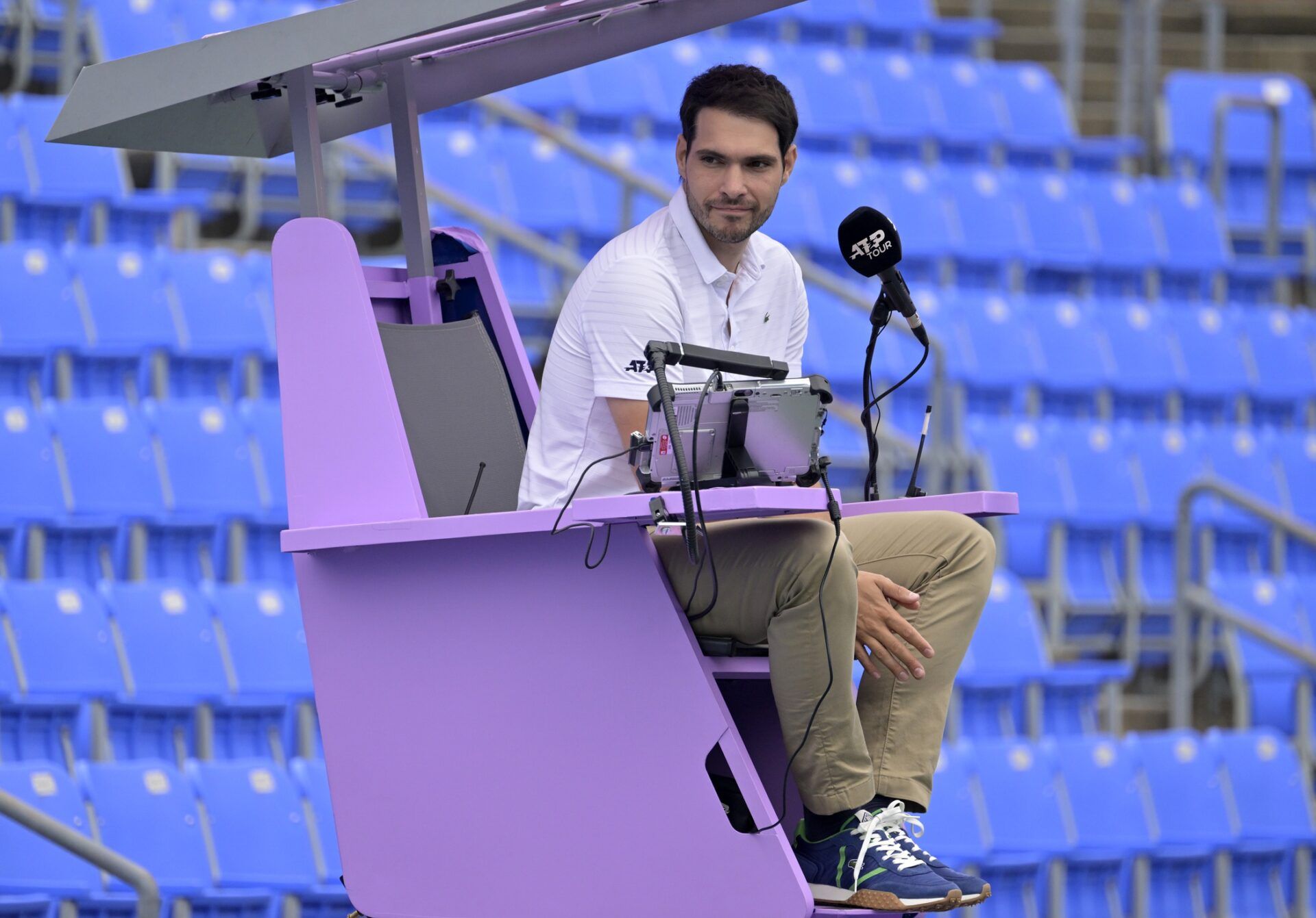 Chair umpire Nacho Forcadell before the match between Brandon Nakashima (USA) and Billy Harris (GBR) (both not pictured) in first round qualifying play at IGA Stadium. The umpire chair have been painted in purple the official color of International Women's Day and to promote the place of women and girls in the sport.