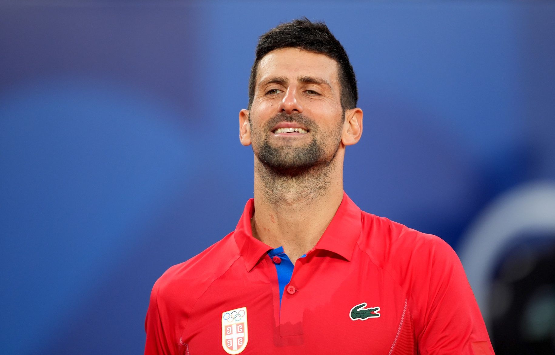 Novak Djokovic (SRB) reacts after wining a semi-final match against Lorenzo Musetti (not pictured) during the Paris 2024 Olympic Summer Games at Stade Roland Garros.