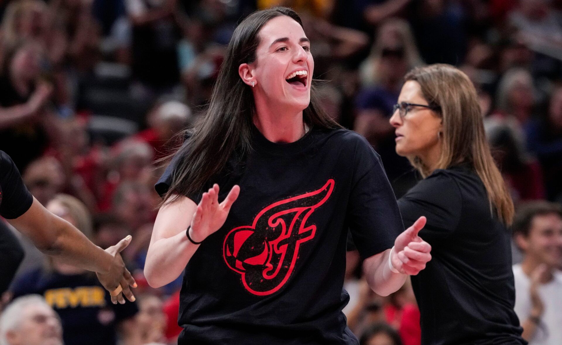 Indiana Fever guard Caitlin Clark (22) yells in excitement Wednesday, July 30, 2025, during the game at Gainbridge Fieldhouse in Indianapolis. The Indiana Fever defeated the Phoenix Mercury, 107-101.