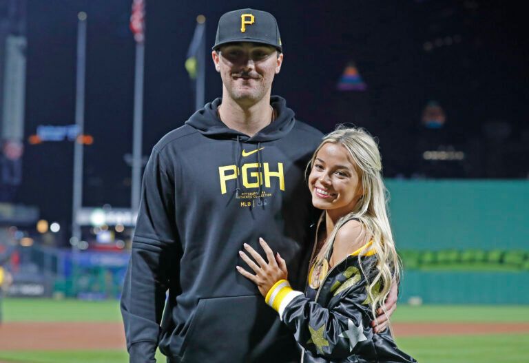 Pittsburgh Pirates starting pitcher Paul Skenes (30) poses with his girlfriend Louisiana State University gymnast Olivia Dunn (right) after making his major league debut against the Chicago Cubs at PNC Park. The Pirates won 10-8.