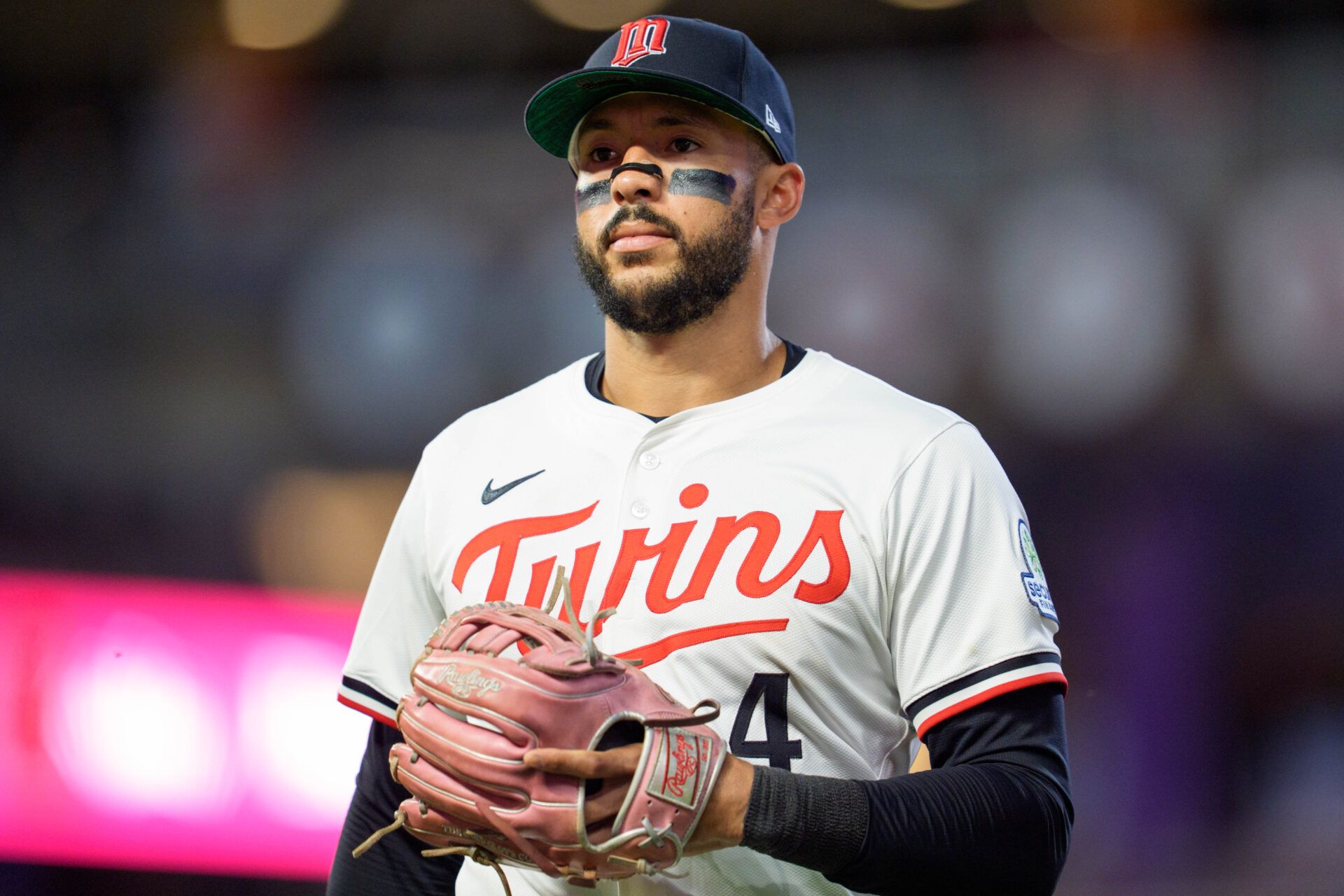Minnesota Twins shortstop Carlos Correa (4) walks to the dugout after the ninth inning against the Washington Nationals at Target Field.