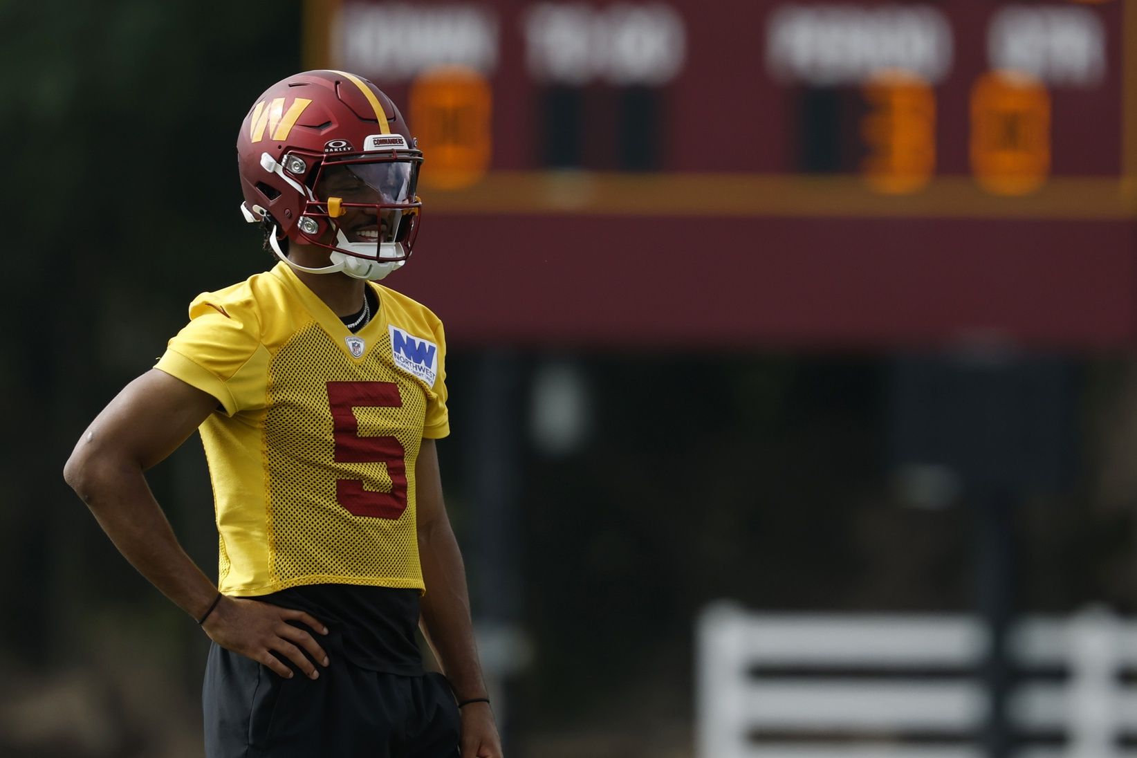 Washington Commanders quarterback Jayden Daniels (5) looks on during practice on day one of training camp at OrthoVirginia Training Center at Commanders Park.