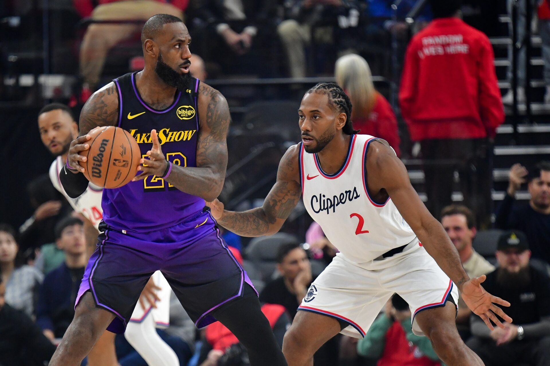 Los Angeles Lakers forward LeBron James (23) moves the ball against Los Angeles Clippers forward Kawhi Leonard (2) during the first half at Intuit Dome.