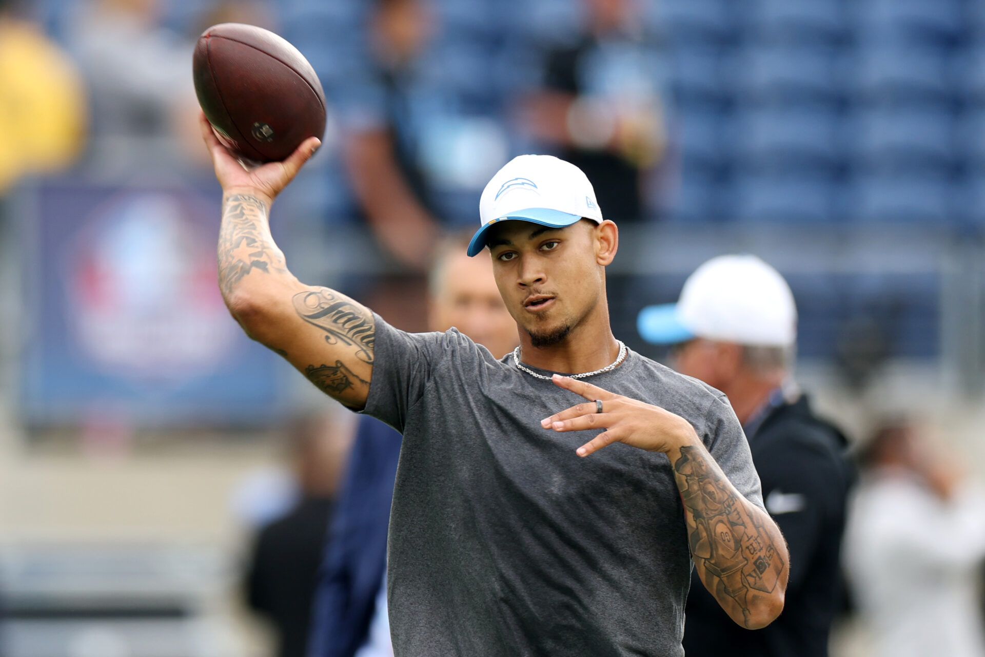 Los Angeles Chargers quarterback Trey Lance (5) warms up before the 2025 Pro Football Hall of Fame Game against the Detroit Lions at Tom Benson Hall of Fame Stadium.