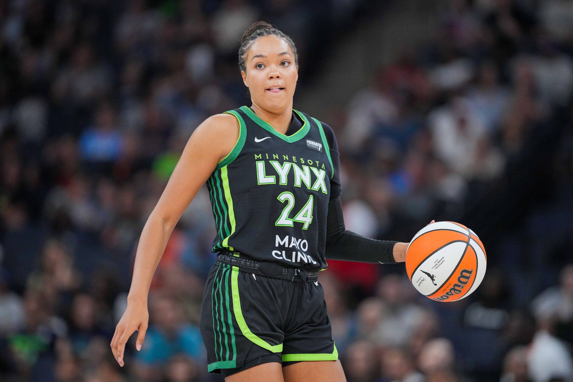 Minnesota Lynx forward Napheesa Collier (24) dribbles against the Las Vegas Aces in the third quarter at Target Center.