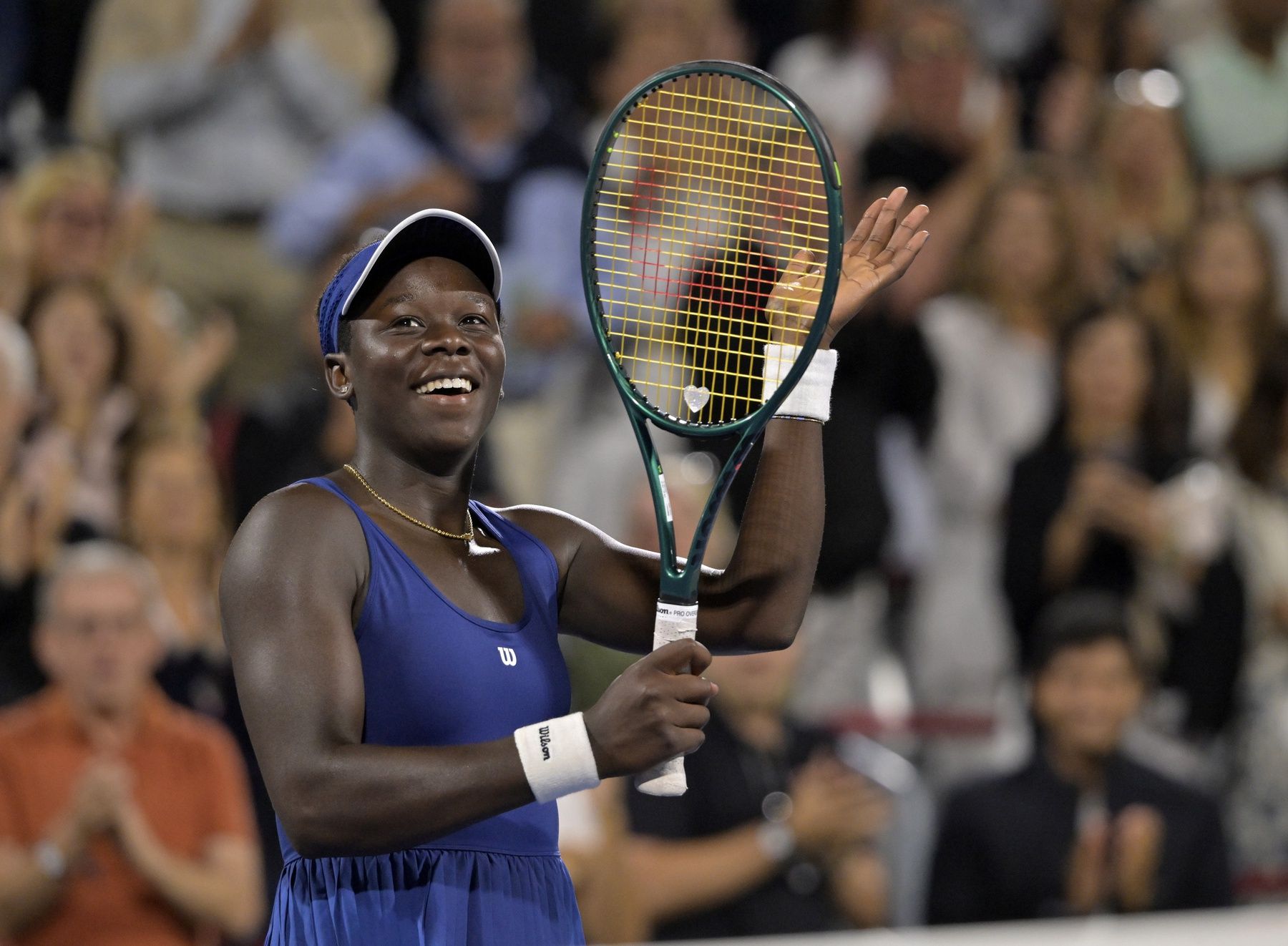 Victoria Mboko (CAN) reacts after winning her match against Marie Bouzkova (CZE) in third round play at IGA Stadium.
